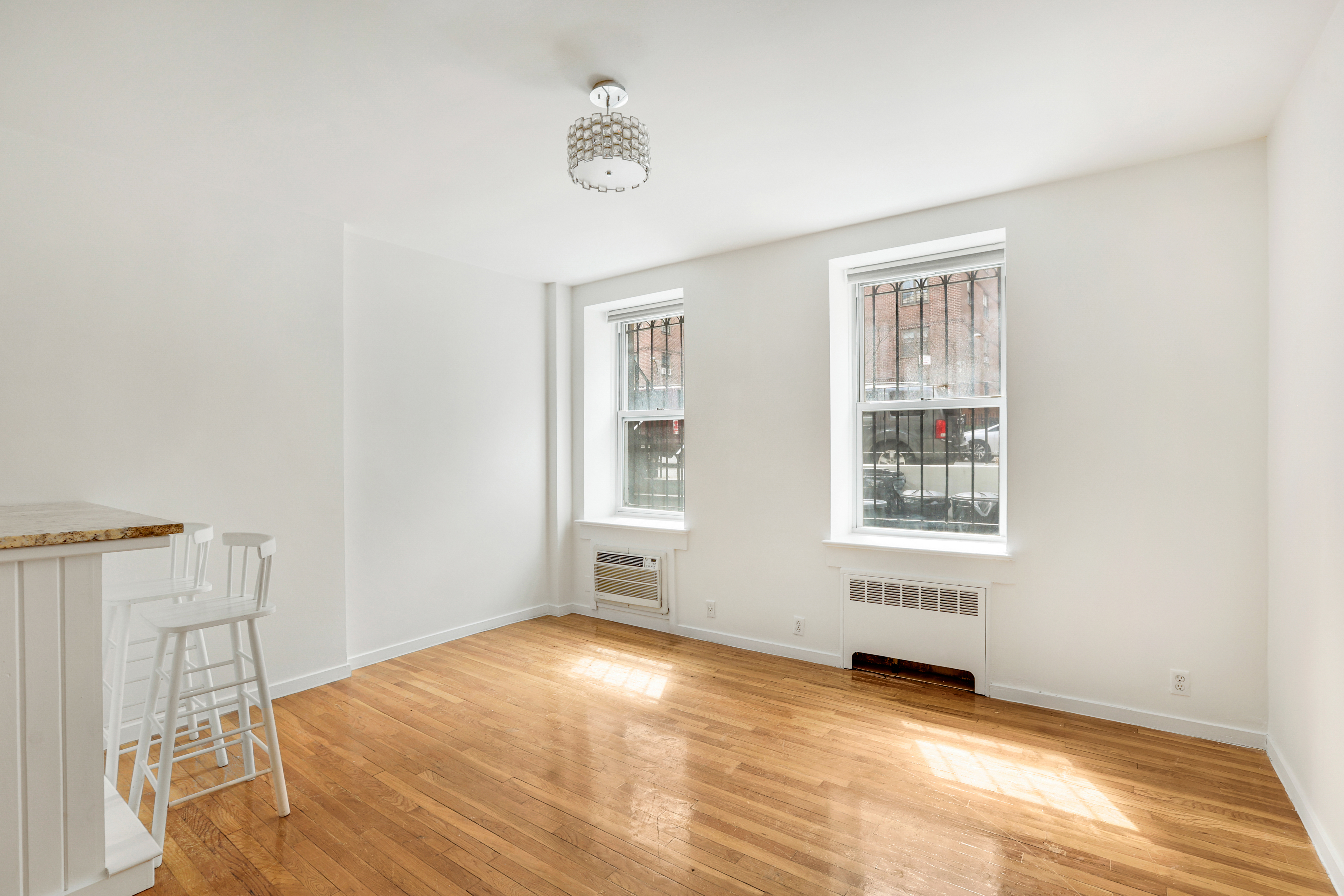 141 West 94th Street, Unit 1F Manhattan, NY 10025 - Photo 7 of 9 a view of an empty room with a window