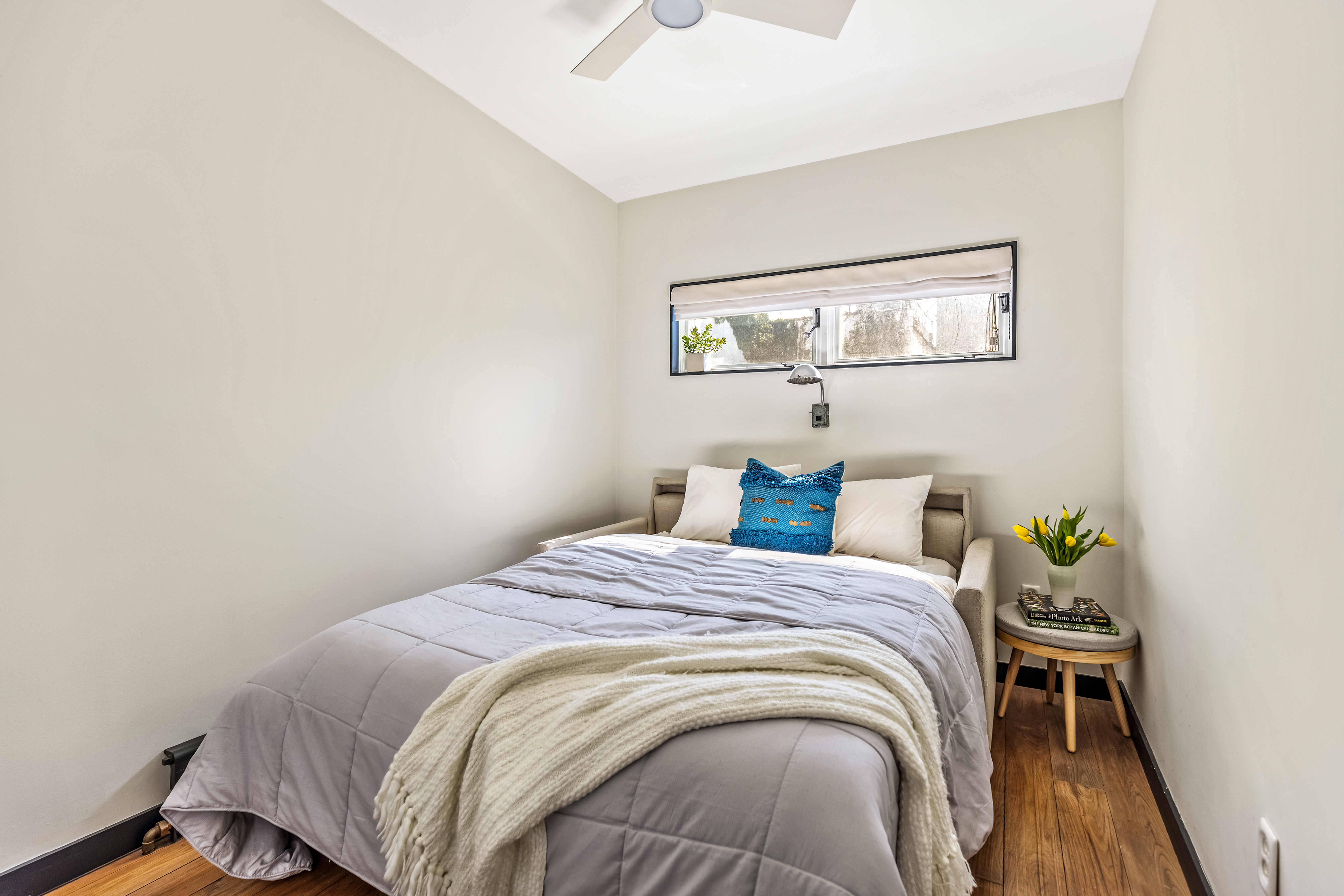 162 10th Street Brooklyn, NY 11215 - Photo 8 of 13 a bedroom with a bed and a table