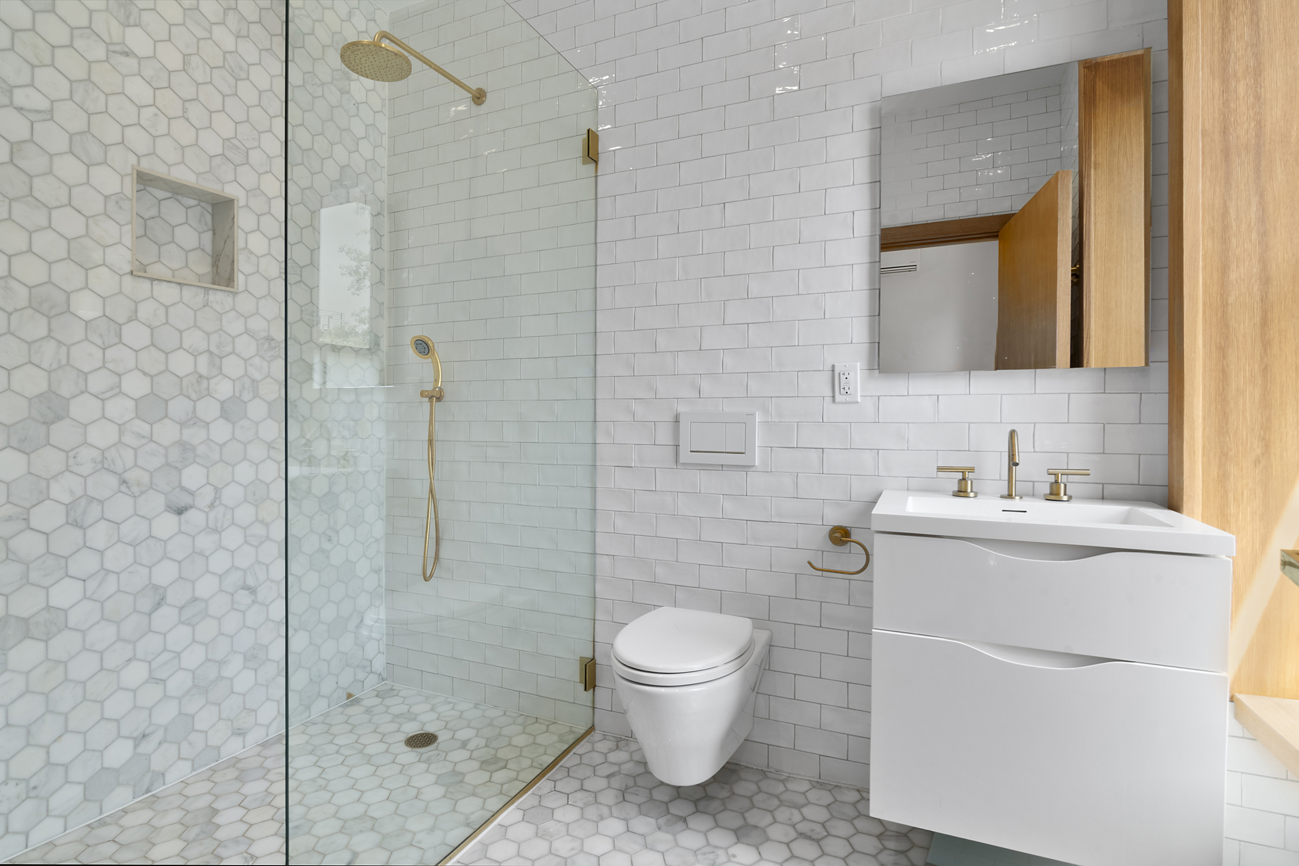 87 Monroe Street Brooklyn, NY 11216 - Photo 11 of 26 a bathroom with a sink toilet and shower