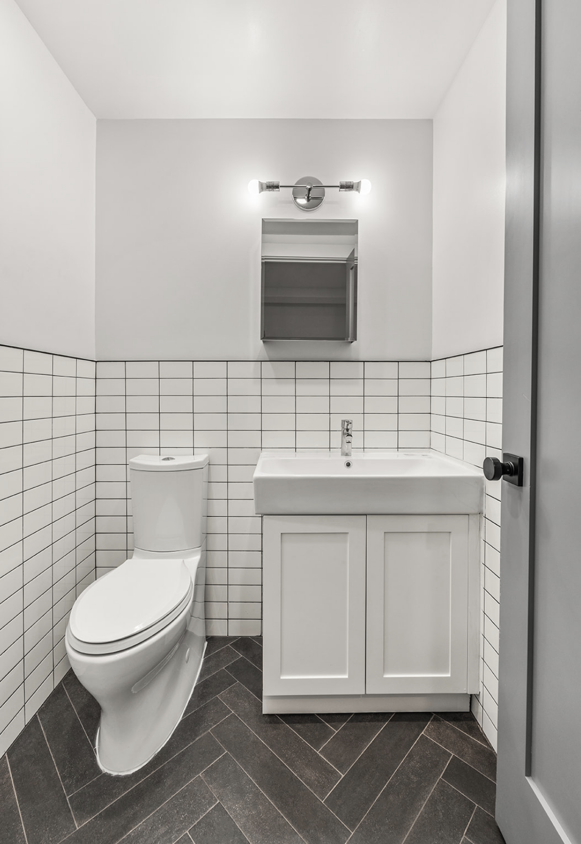 111 Nelson Street, Unit GARDEN Brooklyn, NY 11231 - Photo 9 of 11 a bathroom with a toilet sink and mirror