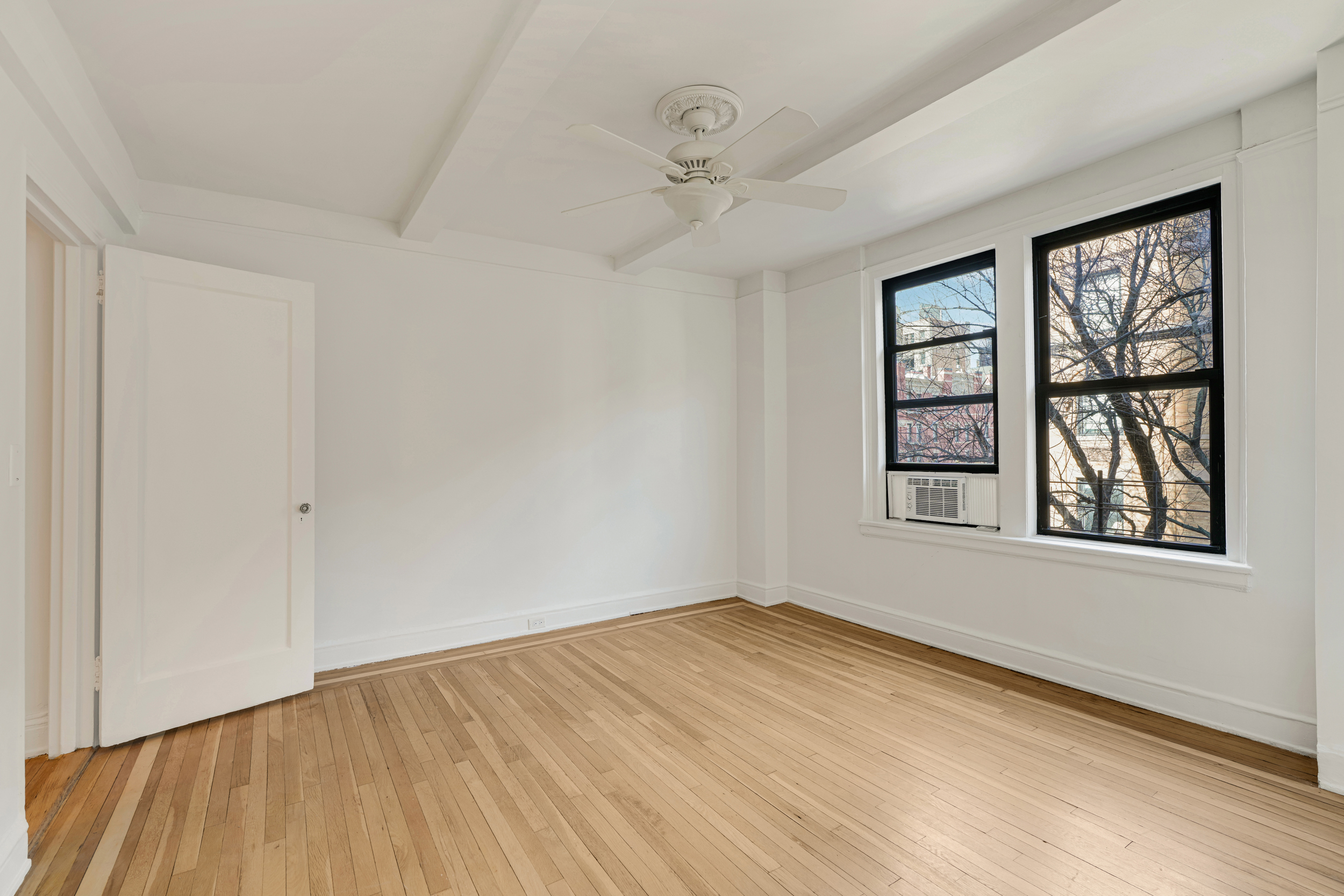 74 West 68th Street, Unit 5A Manhattan, NY 10023 - Photo 20 of 25 an empty room with windows