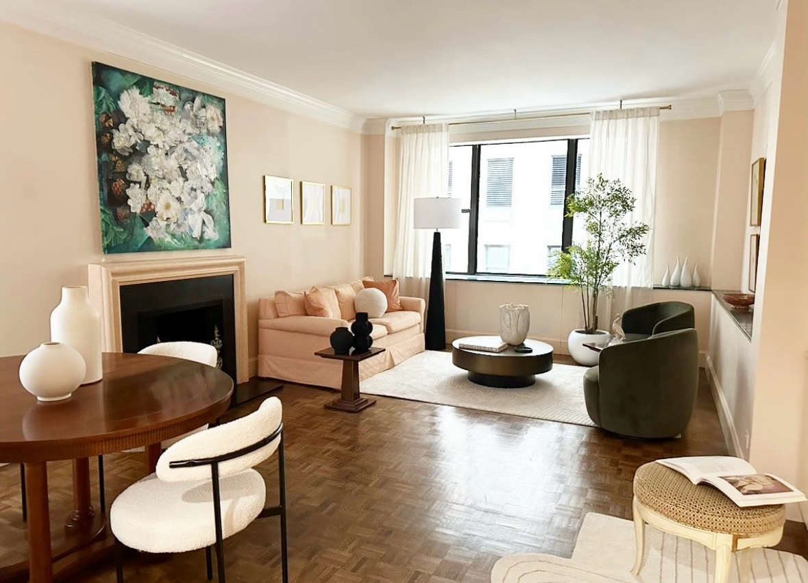 475 Park Avenue, Unit 11E Manhattan, NY 10022 - Photo 1 of 9 a living room with furniture and a fireplace