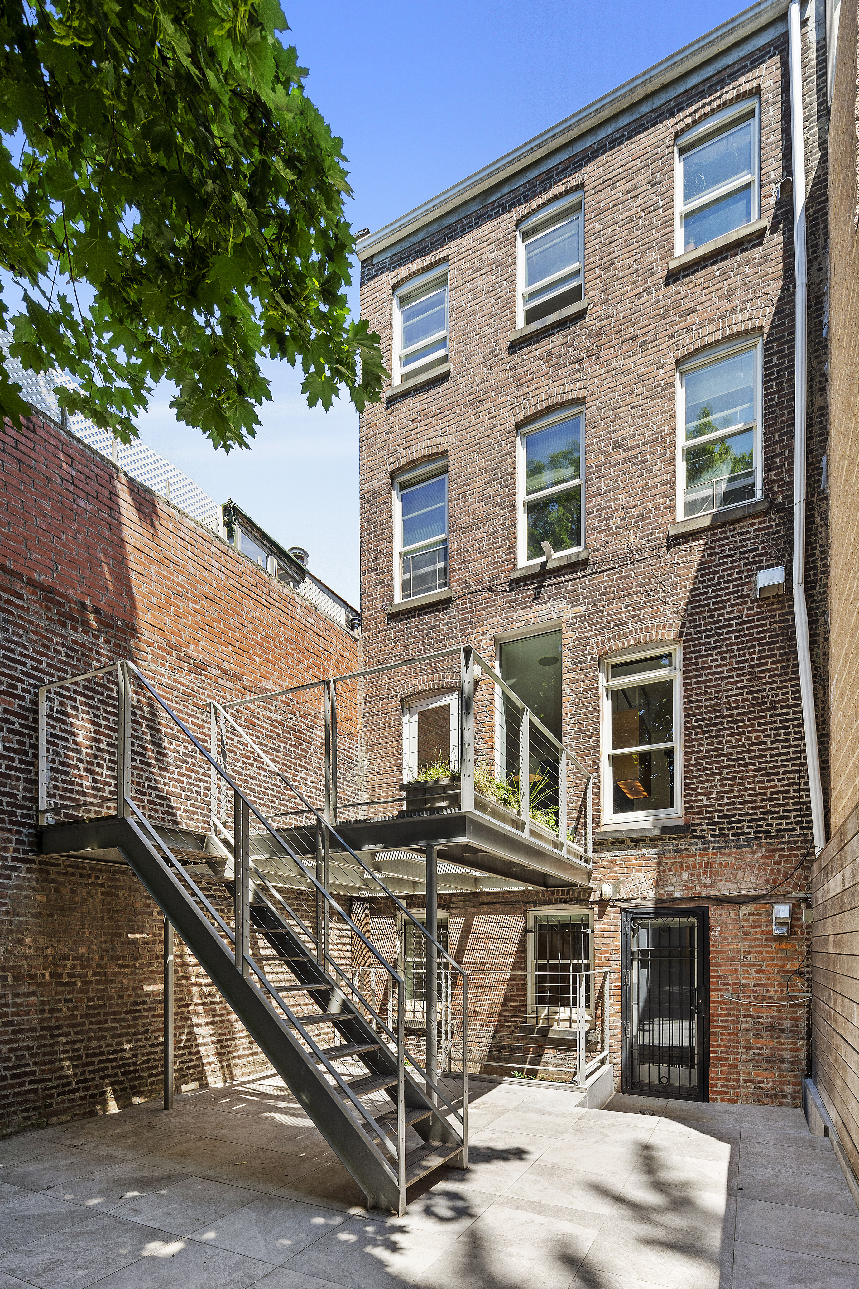 64 Clifton Place Brooklyn, NY 11238 - Photo 12 of 22 a front view of a building with balcony