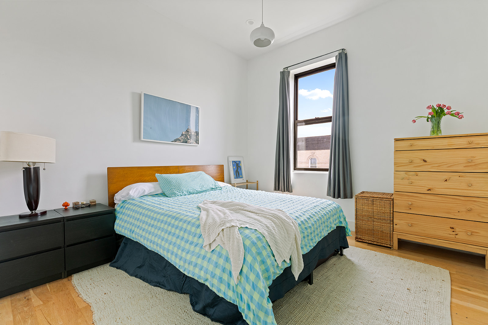 1474 Bushwick Avenue, Unit 4R Brooklyn, NY 11207 - Photo 4 of 8 a bedroom with a bed and a window