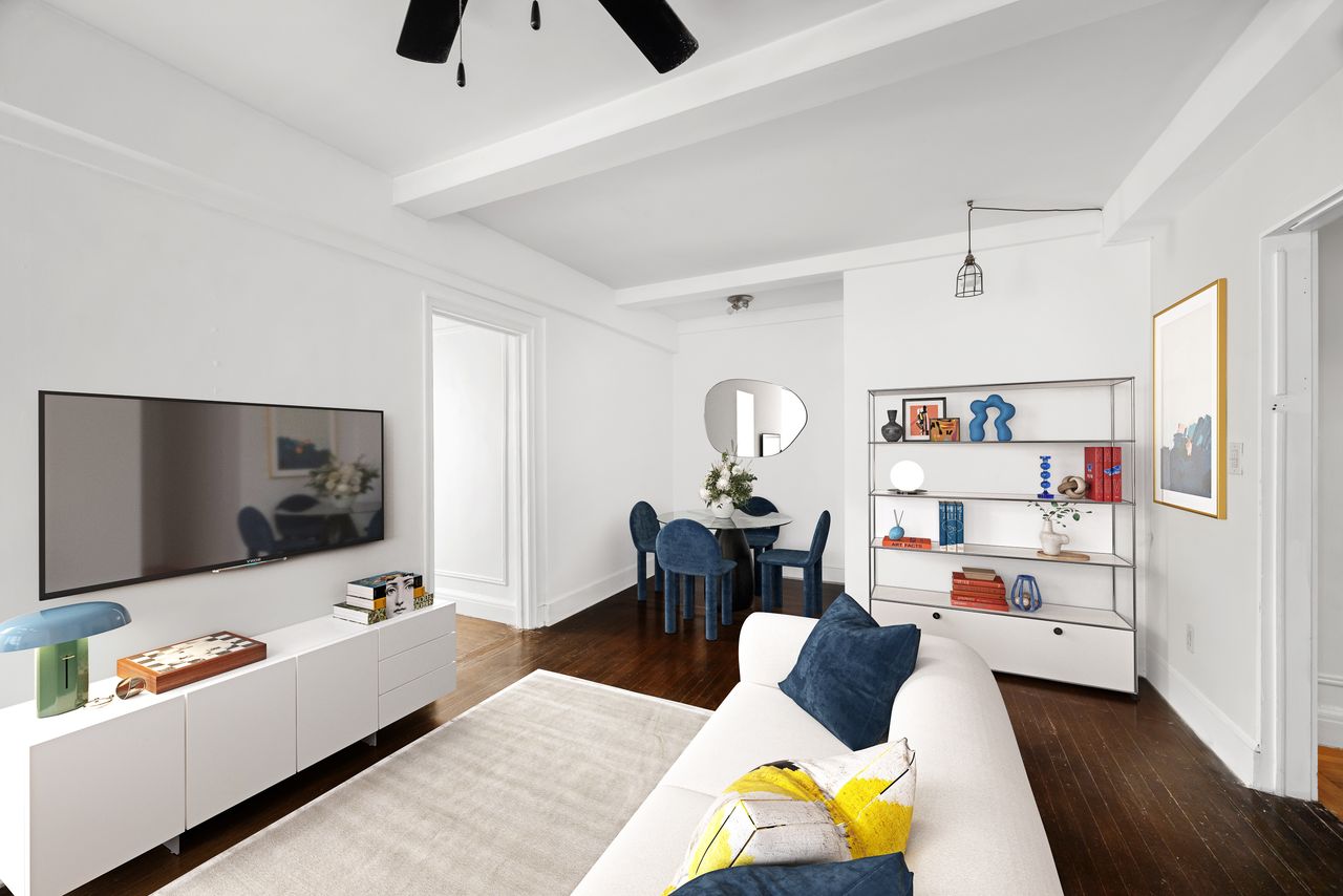 325 West 45th Street, Unit 205 Manhattan, NY 10036 - Photo 3 of 14 a living room with furniture and a flat screen tv
