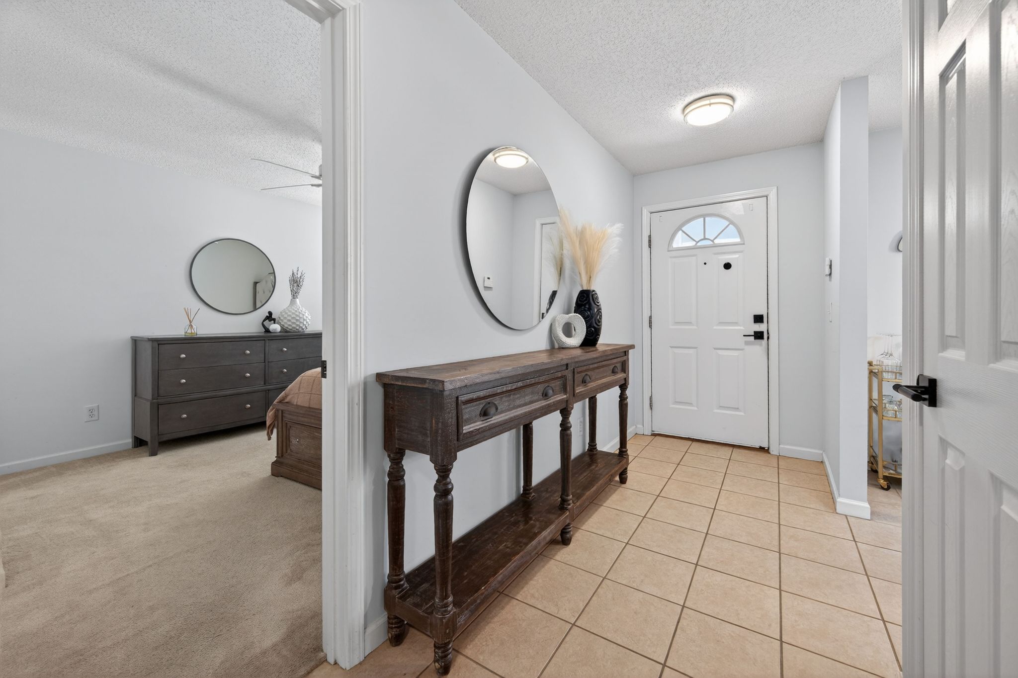 Huntscroft Lane Raleigh, NC 27617 - Photo 18 of 49 a view of a hallway with entryway wooden floor and front door