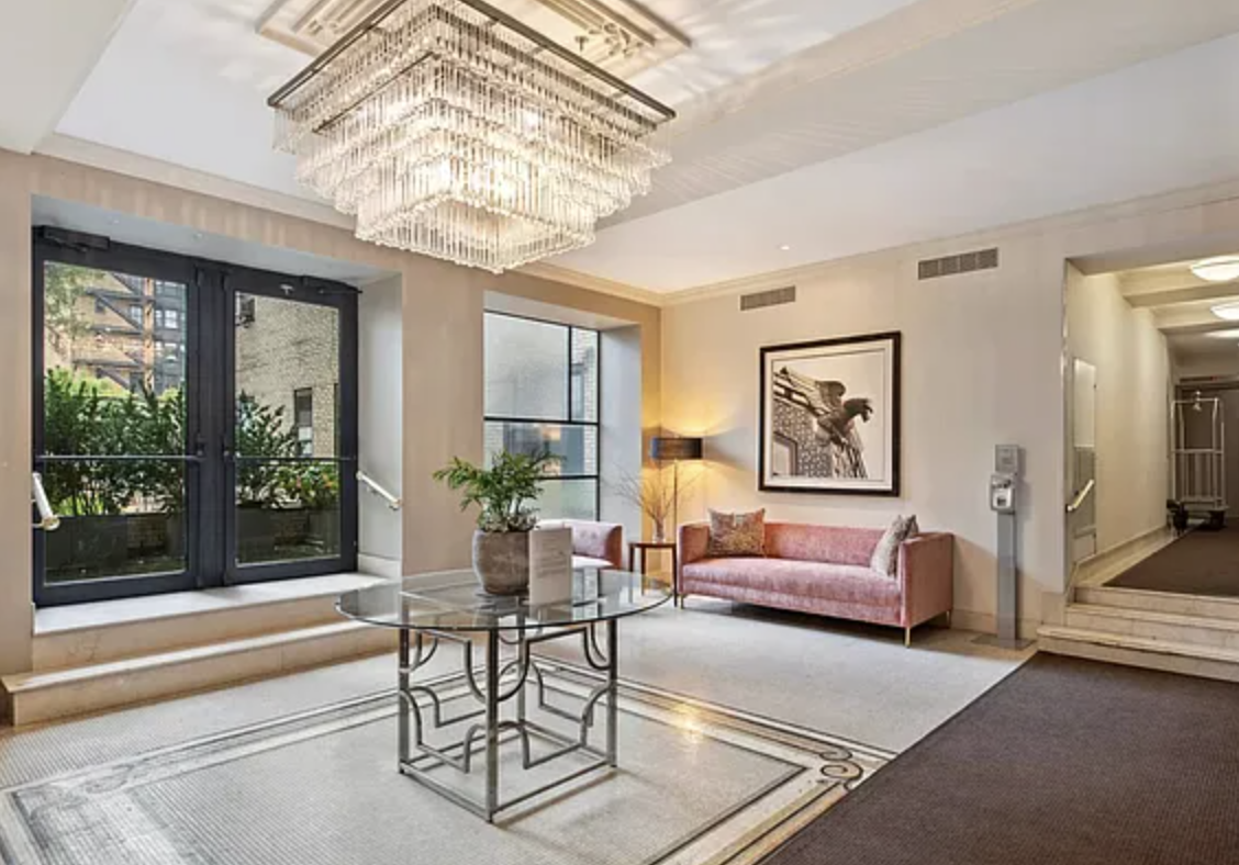 230 Riverside Drive, Unit 8C Manhattan, NY 10025 - Photo 6 of 10 a living room with furniture and a chandelier