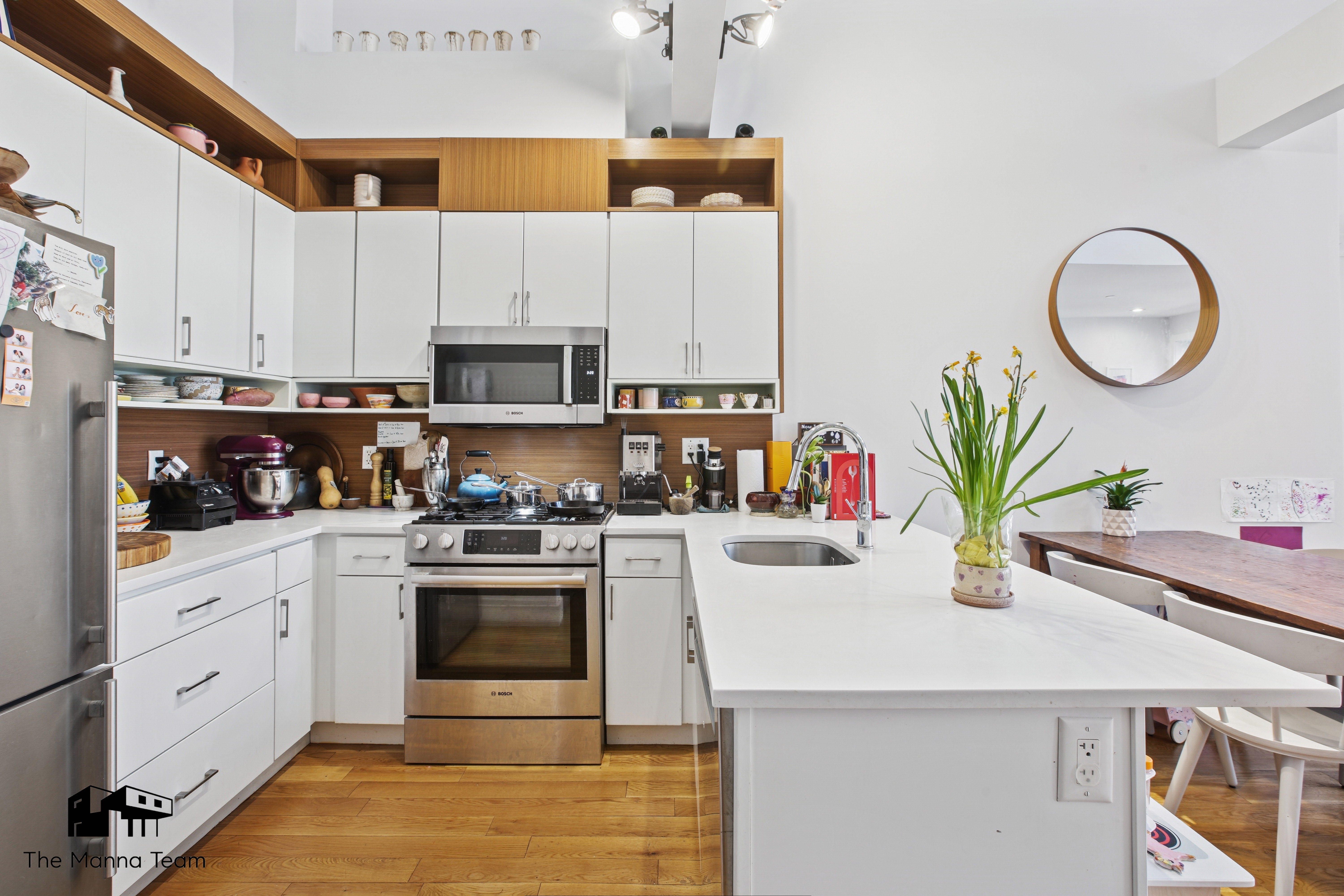 385 Jefferson Avenue, Unit C Brooklyn, NY 11221 - Photo 6 of 21 a kitchen with a white stove top oven and white cabinets