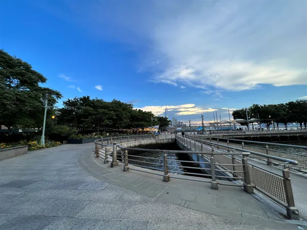 a view of a terrace with outdoor seating and city view