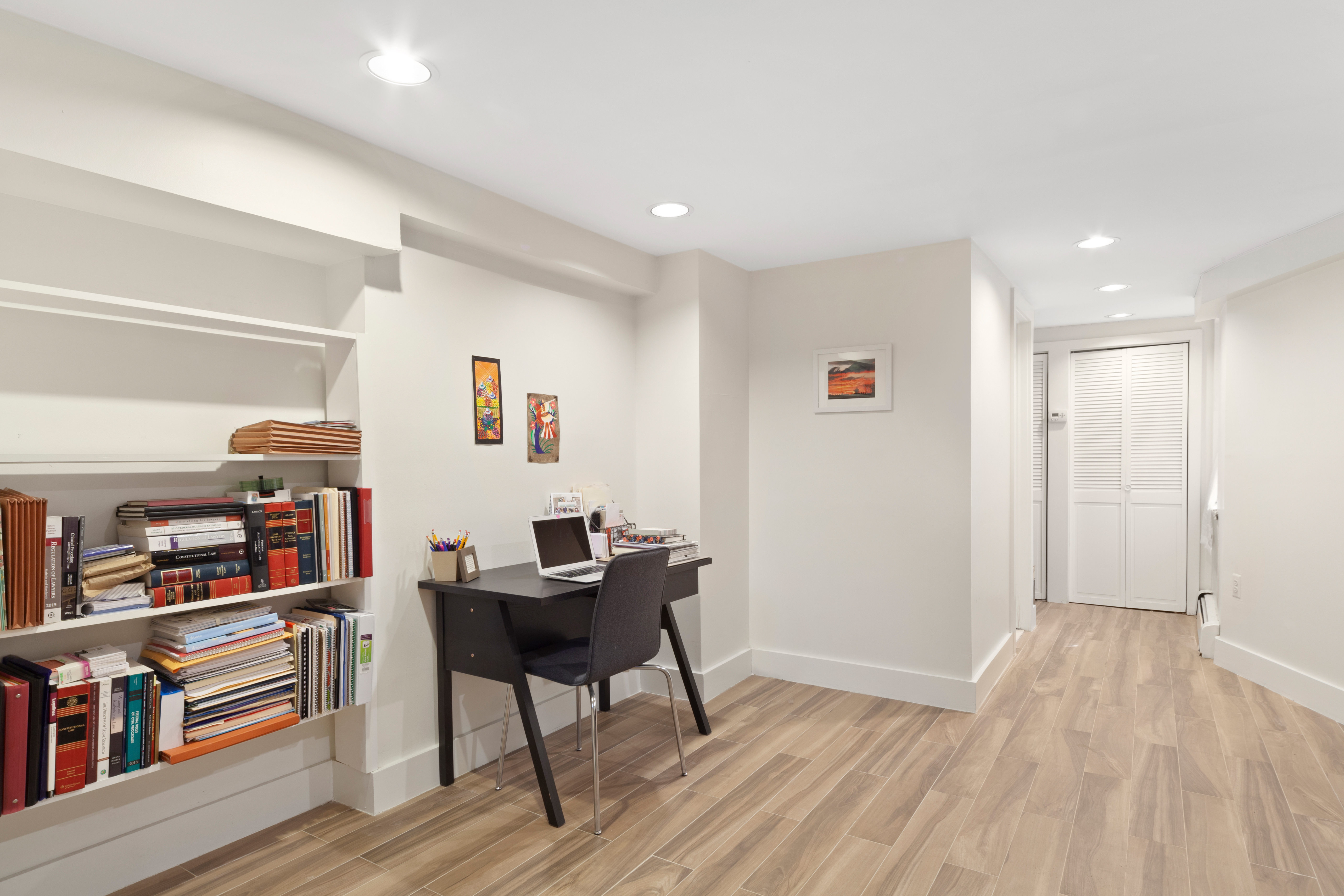 2116 Dorchester Road, Unit 1I Brooklyn, NY 11226 - Photo 9 of 15 a view of a workspace with furniture and wooden floor