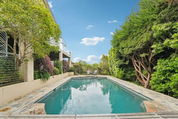 a view of swimming pool from a balcony