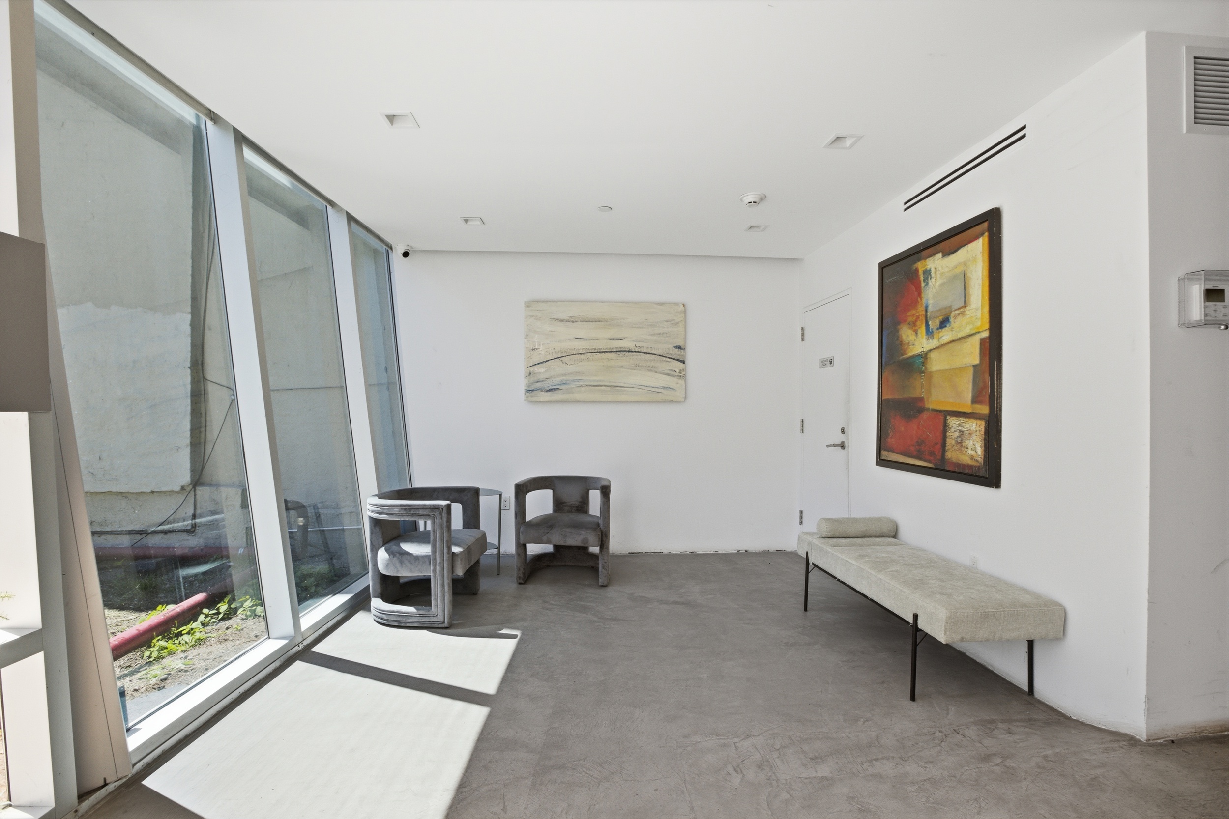 313 West 121st Street, Unit 2 Manhattan, NY 10027 - Photo 10 of 12 a living room with furniture and a window