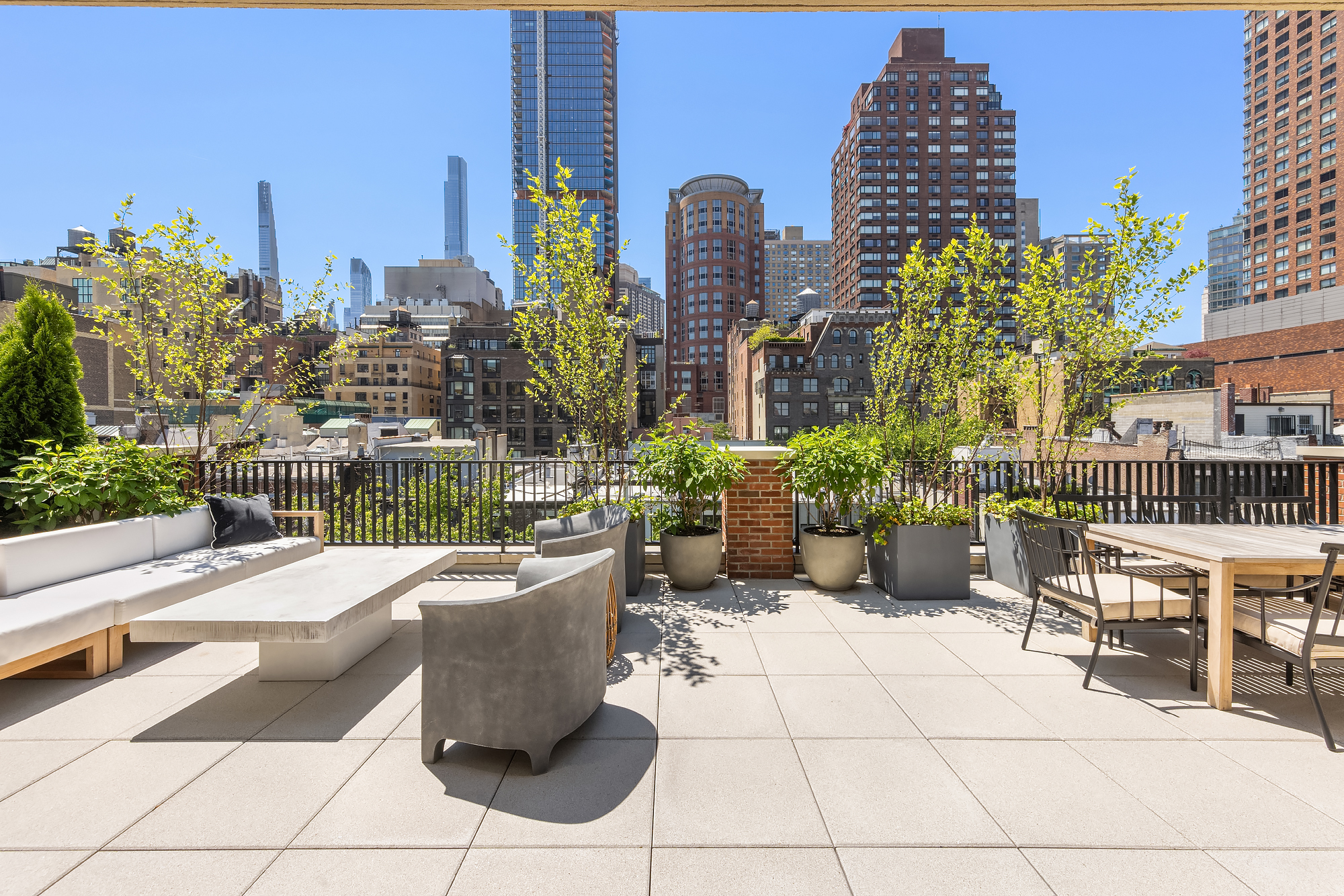48-50 West 69th Street Manhattan, NY 10023 - Photo 23 of 33 a view of a patio with couches and potted plants