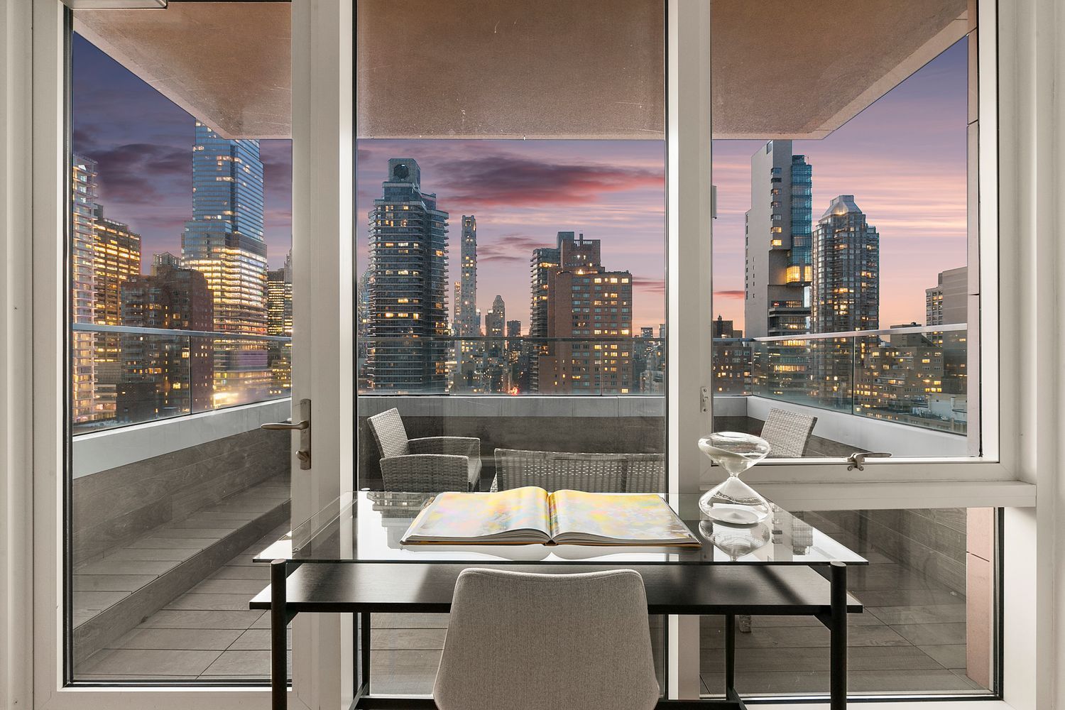 301 East 61st Street, Unit 16A Manhattan, NY 10065 - Photo 12 of 17 a room with a table chairs and a floor to ceiling window