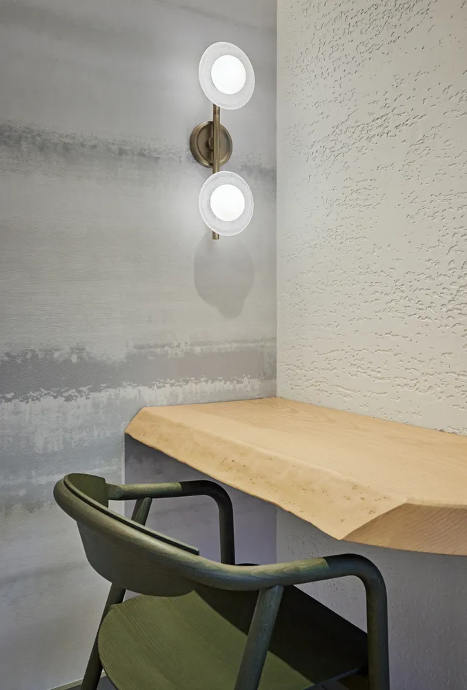 a dining room with a table and chairs