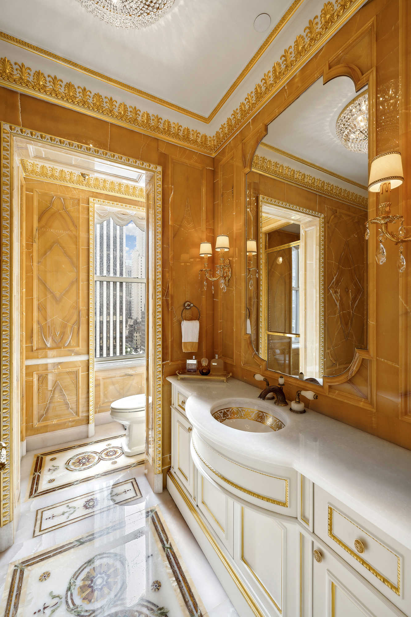 1 Central Park South, Unit 10071009 Manhattan, NY 10019 - Photo 21 of 28 a bathroom with a sink and a mirror