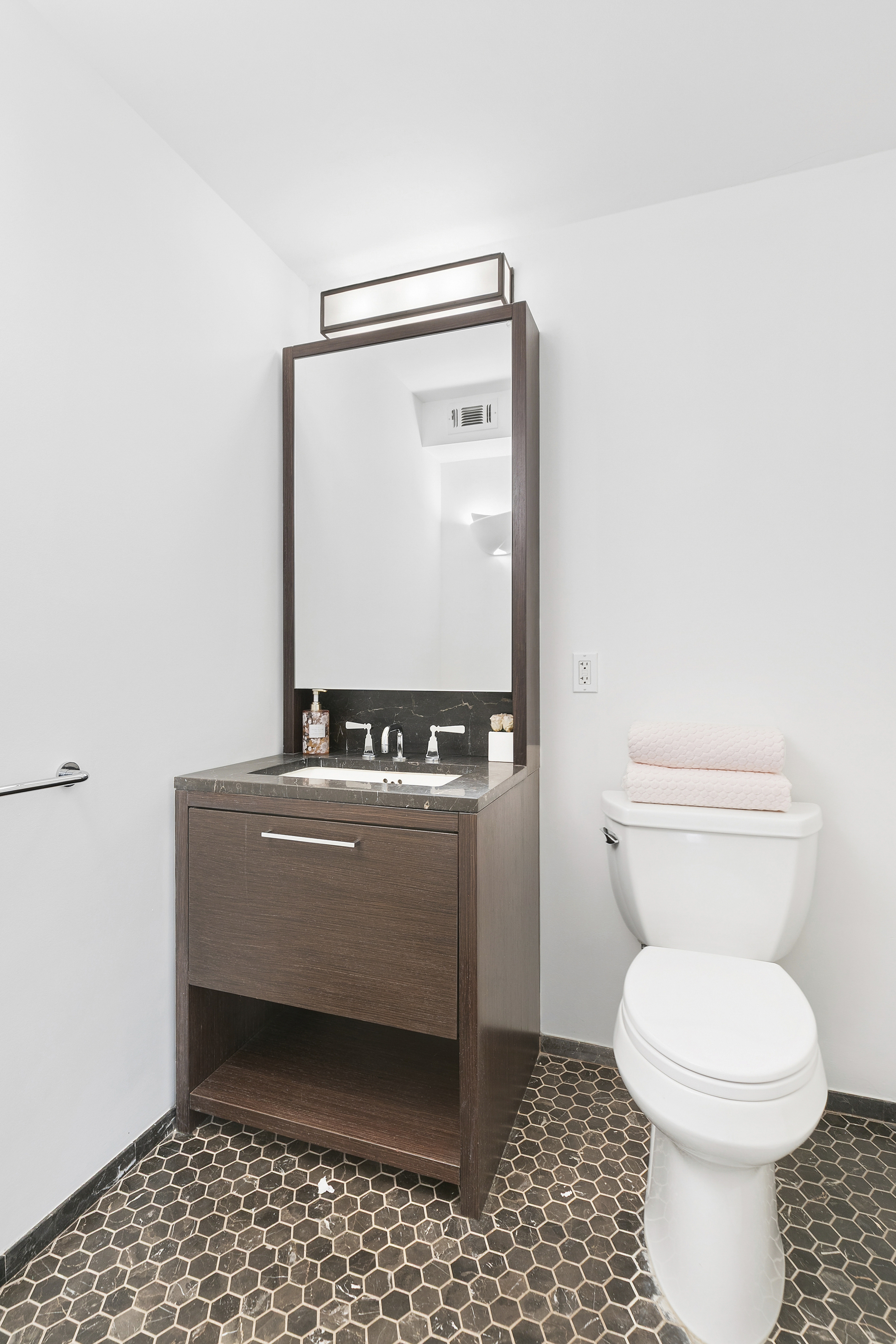 101 West 87th Street, Unit 505 Manhattan, NY 10024 - Photo 12 of 15 a bathroom with a toilet and a mirror