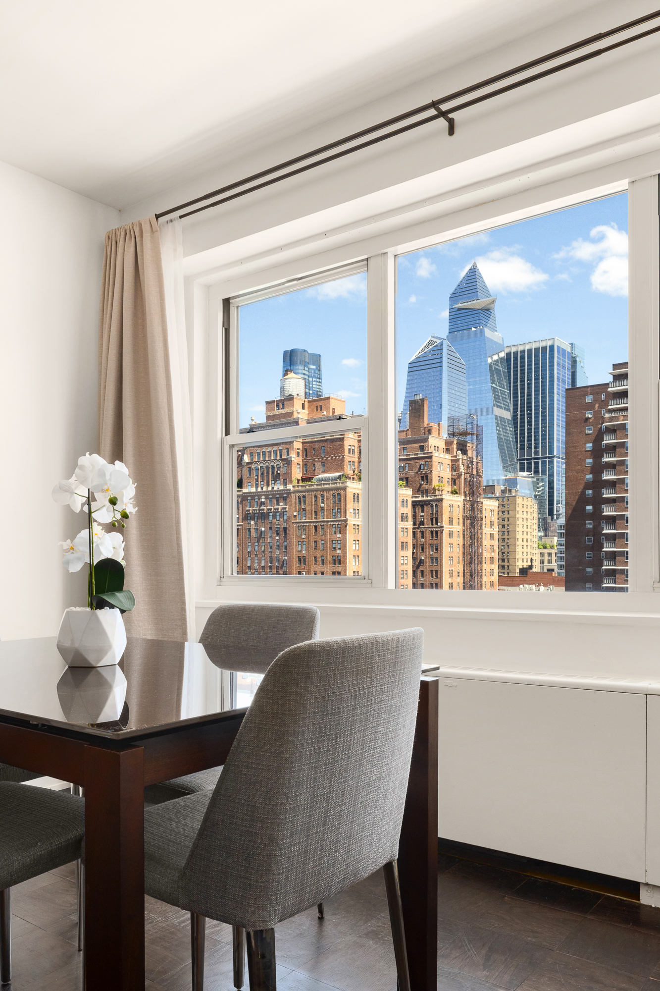 360 West 22nd Street, Unit 12L Manhattan, NY 10011 - Photo 5 of 21 a dining room with furniture and window