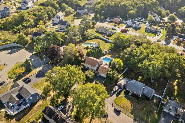 an aerial view of residential houses with outdoor space
