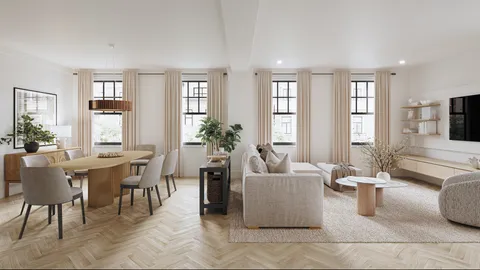a living room with furniture potted plant and windows