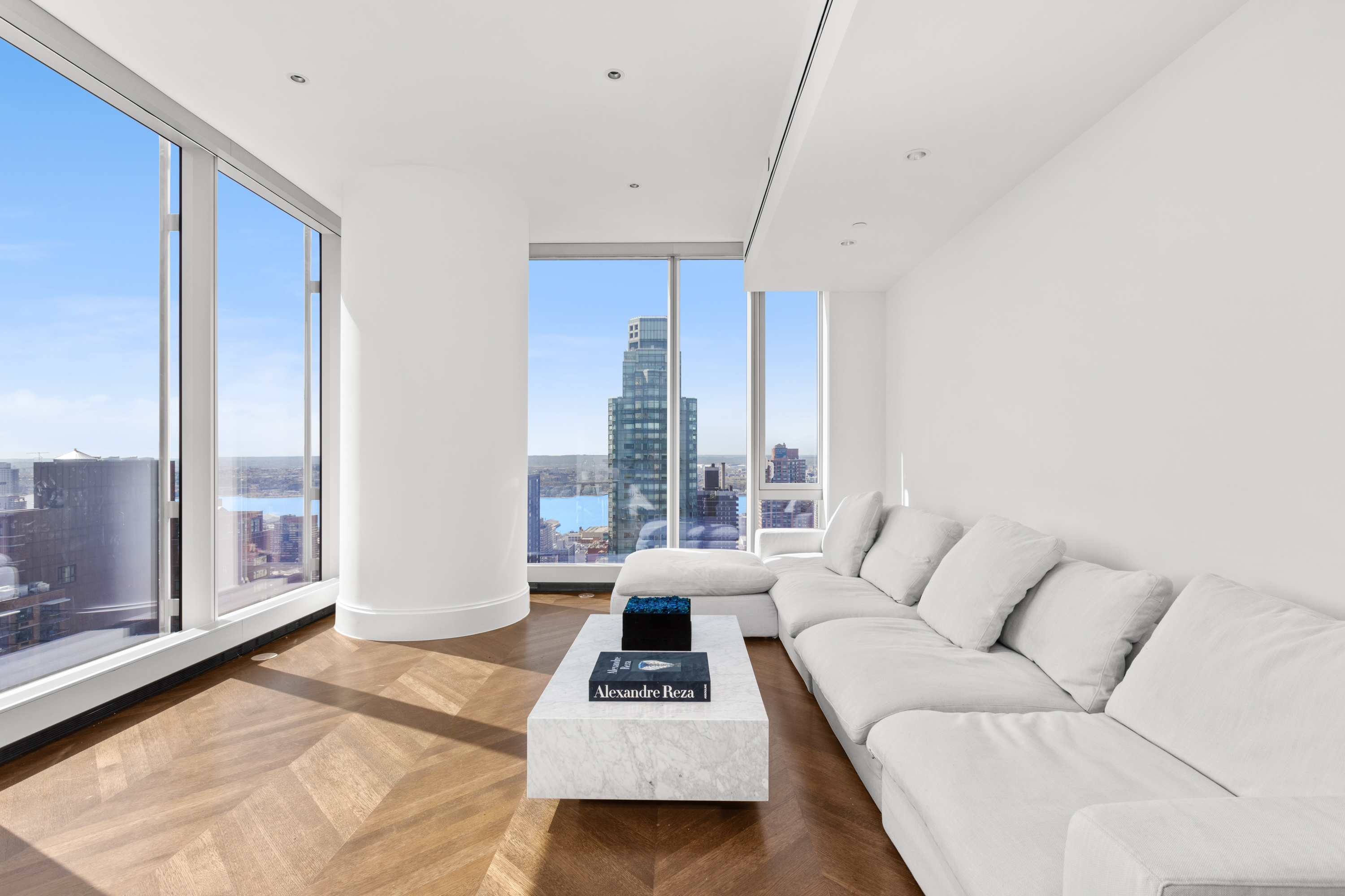 217 West 57th Street, Unit 48D Manhattan, NY 10019 - Photo 2 of 17 a living room with furniture and a window
