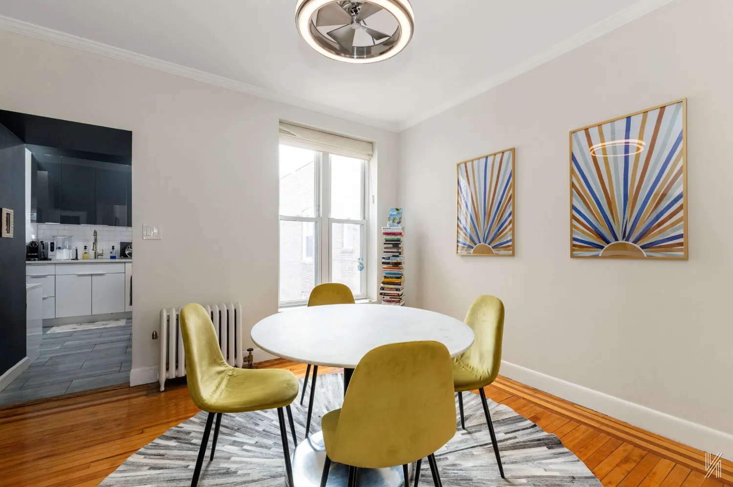 a view of a dining room with furniture and wooden floor