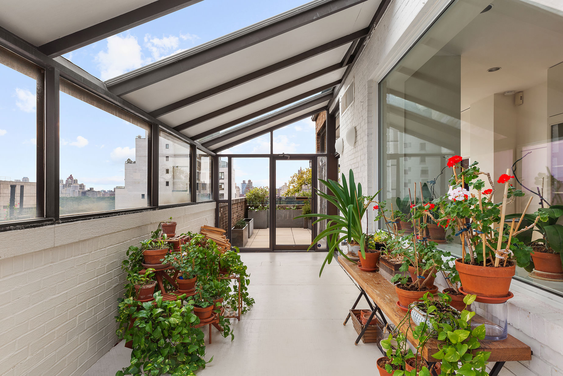 14 East 90th Street, Unit PHW Manhattan, NY 10128 - Photo 12 of 25 a lobby with chair and wooden floor