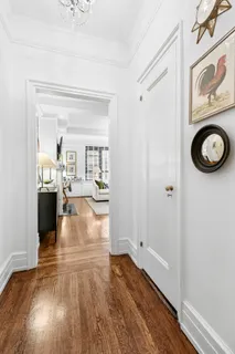 a view of living room with wooden floor