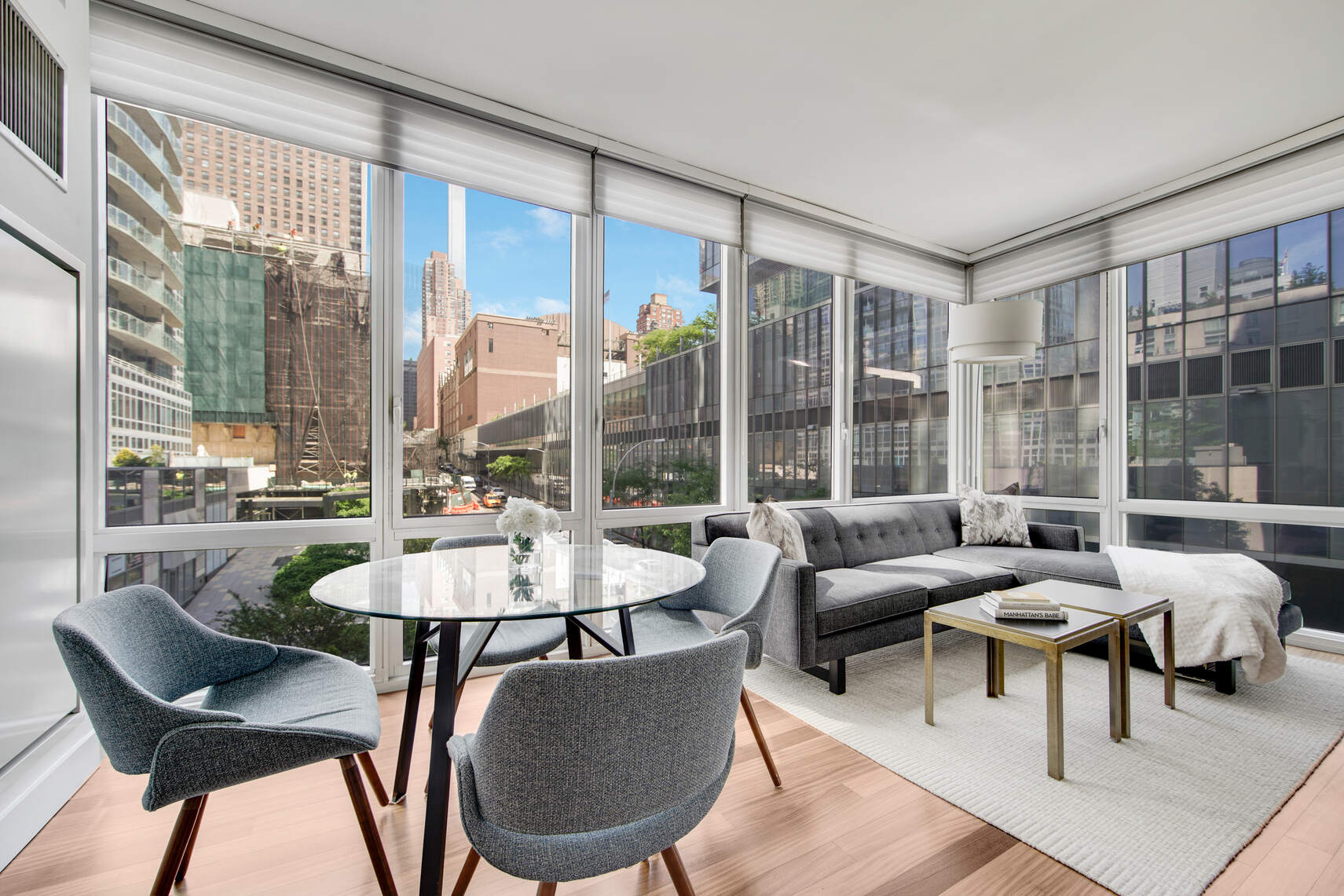 10 West End Avenue, Unit 4J Manhattan, NY 10023 - Photo 2 of 15 a living room with furniture and a large window
