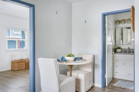 a view of kitchen with furniture and wooden floor