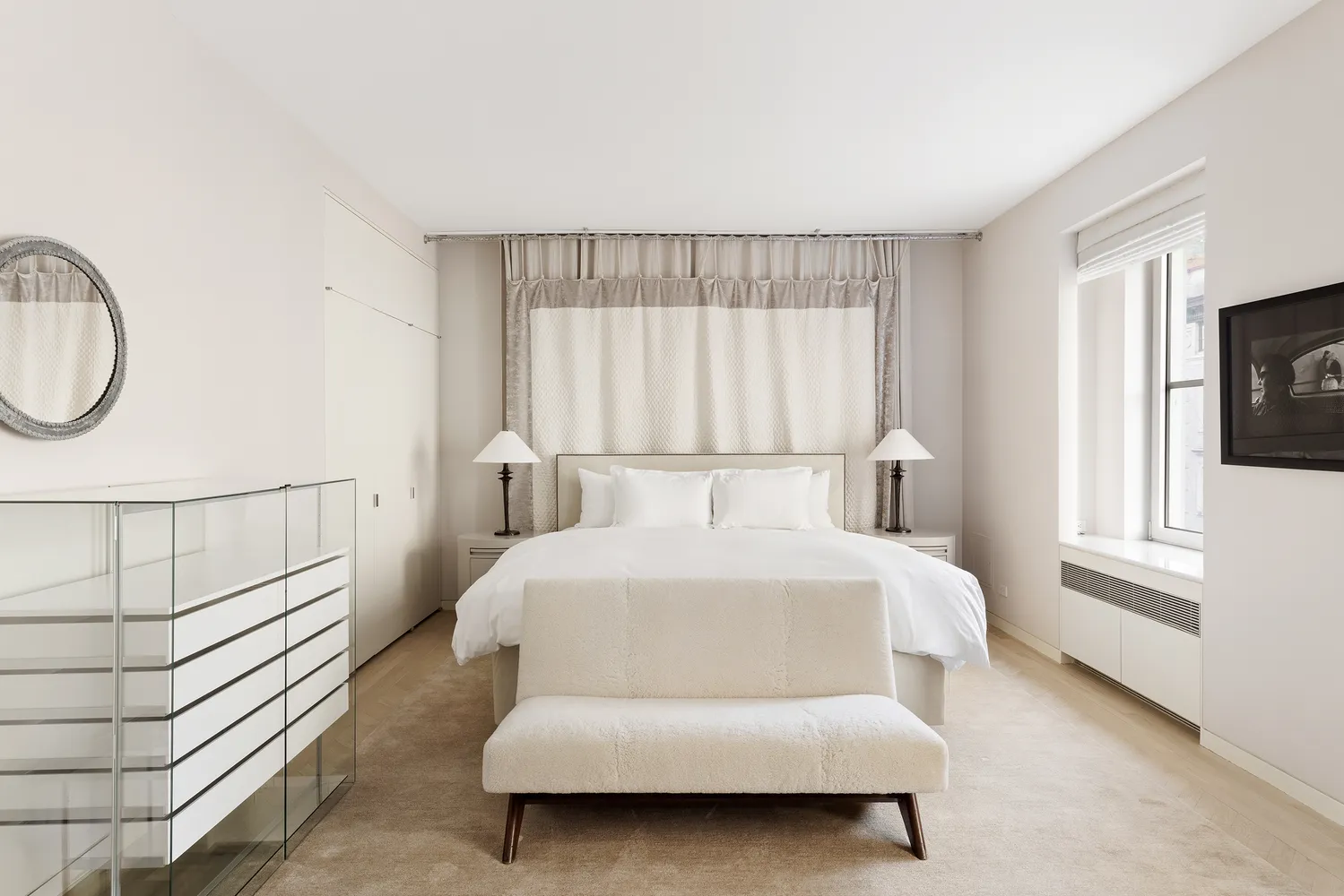 a bed room with a bed and a window