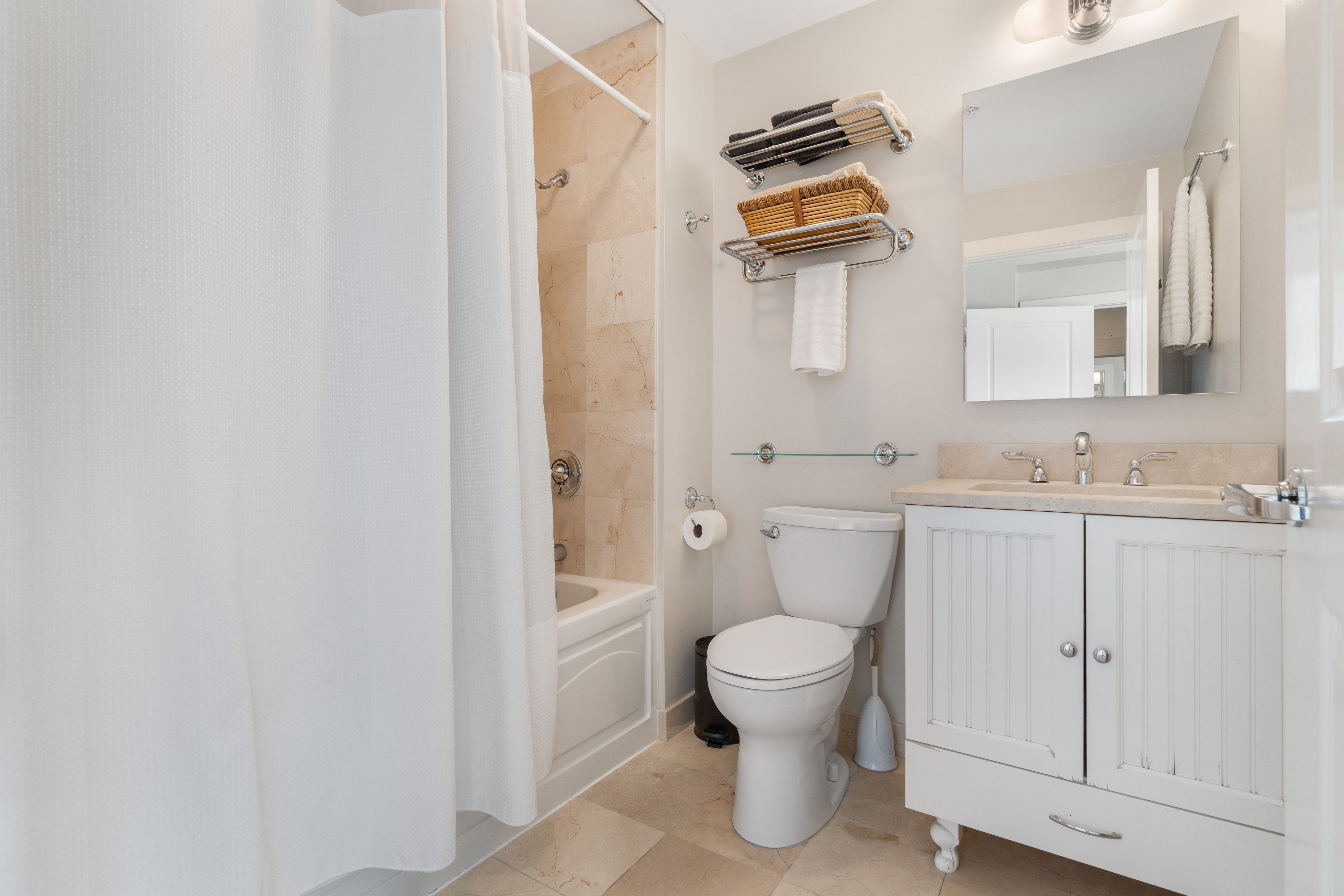 2 Rollins Street, Unit D601 Boston, MA 02118 - Photo 23 of 29 a bathroom with a granite countertop toilet and sink