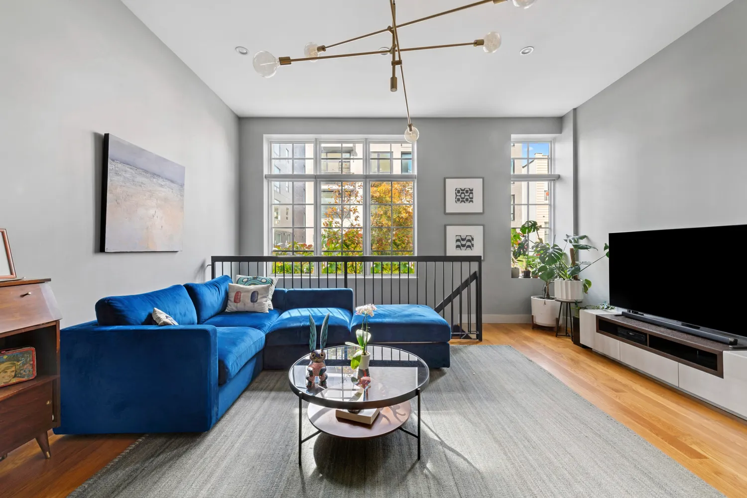 a living room with furniture and a flat screen tv