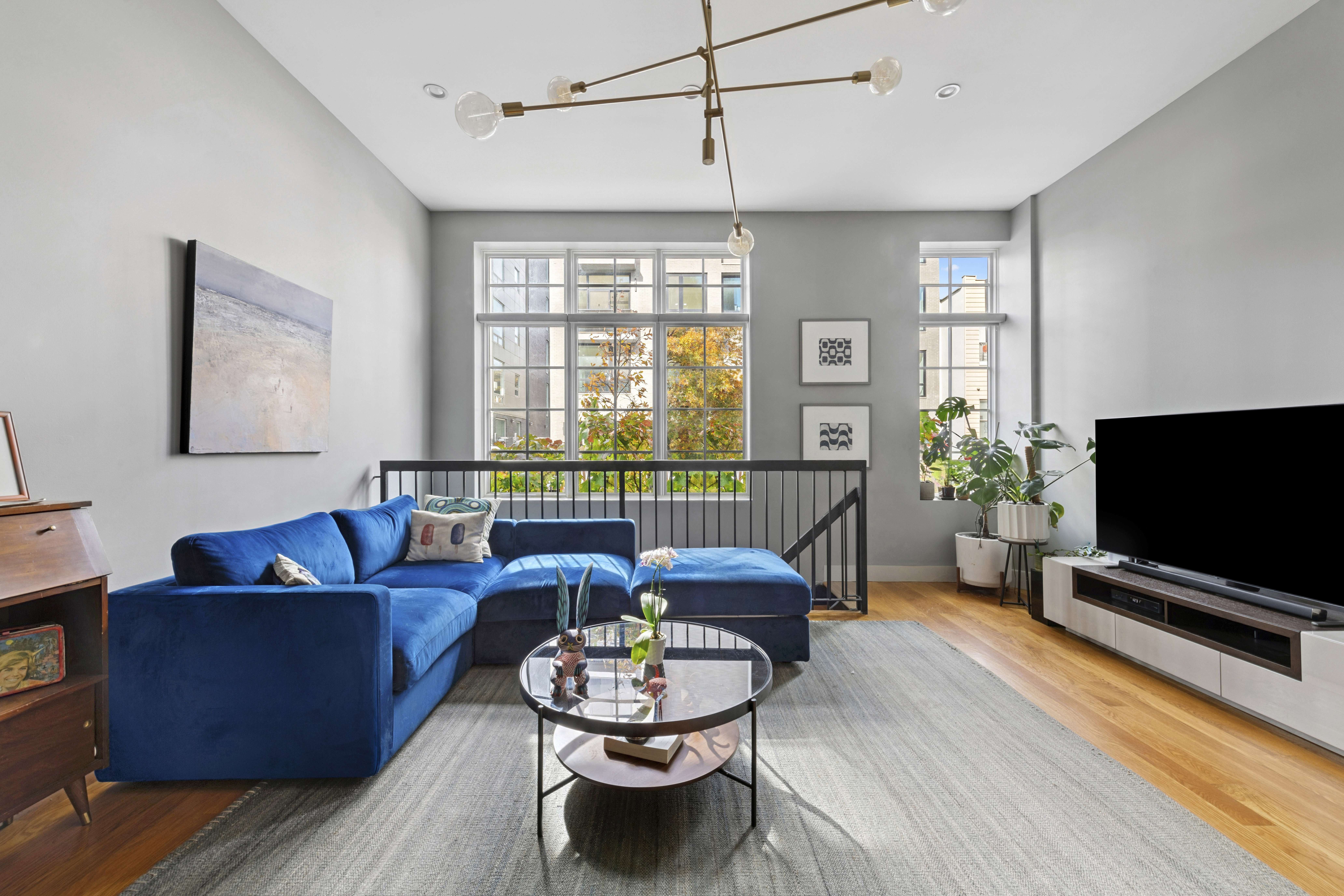 222 Withers Street, Unit 1A Brooklyn, NY 11211 - Photo 3 of 15 a living room with furniture and a flat screen tv