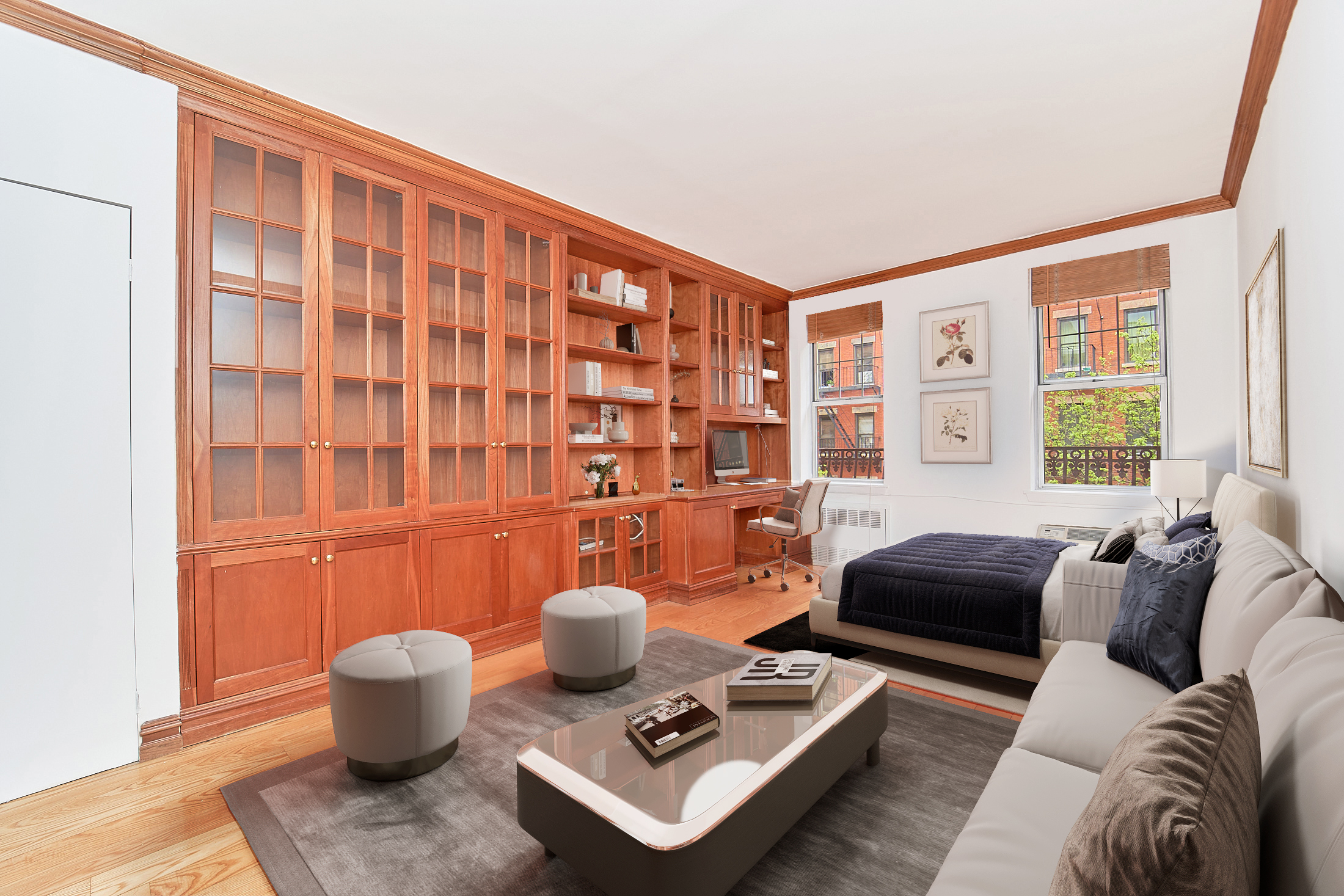 a living room with furniture and a potted plant