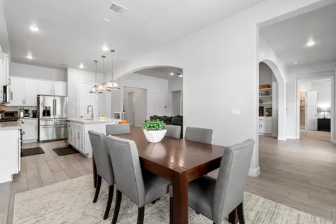 a dining room with furniture and window