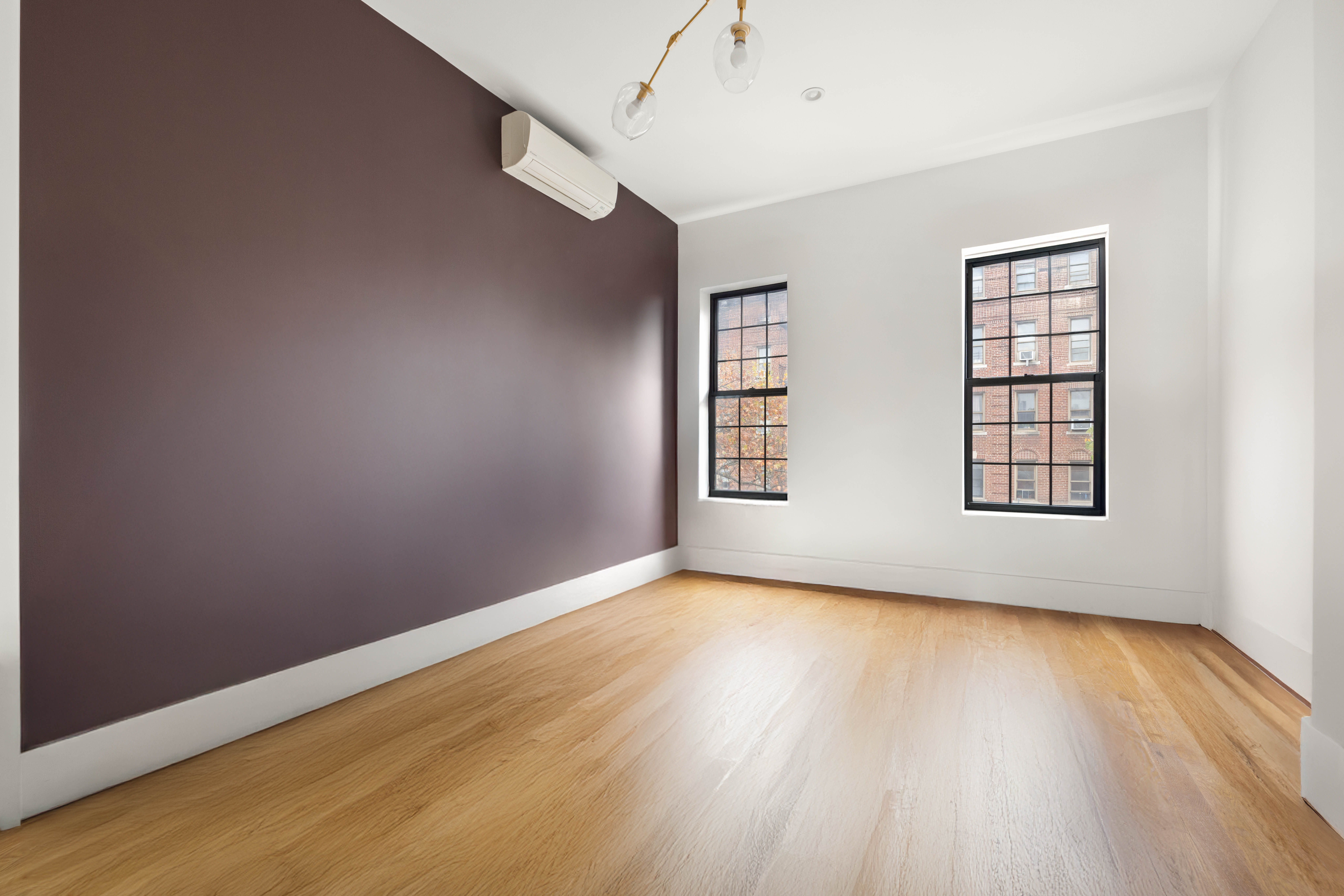 750 Lincoln Place Brooklyn, NY 11216 - Photo 11 of 24 an empty room with wooden floor and windows