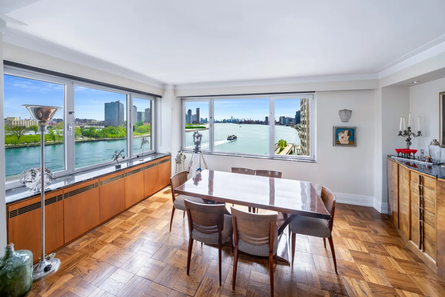 a dining room with furniture a window and a rug