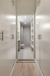 a bathroom with a glass shower door