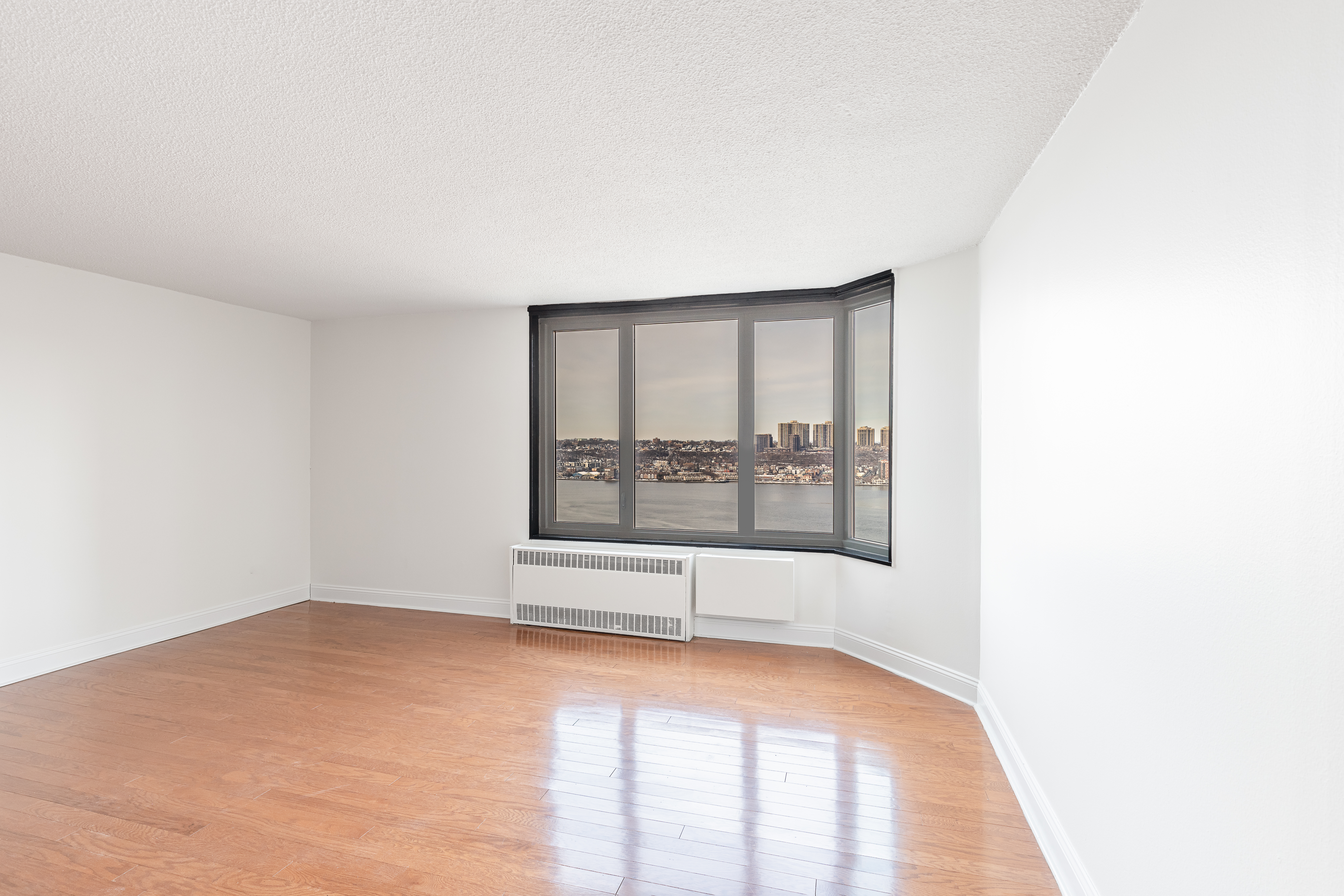 3333 Broadway, Unit C7K Manhattan, NY 10031 - Photo 2 of 21 a view of an empty room with a window