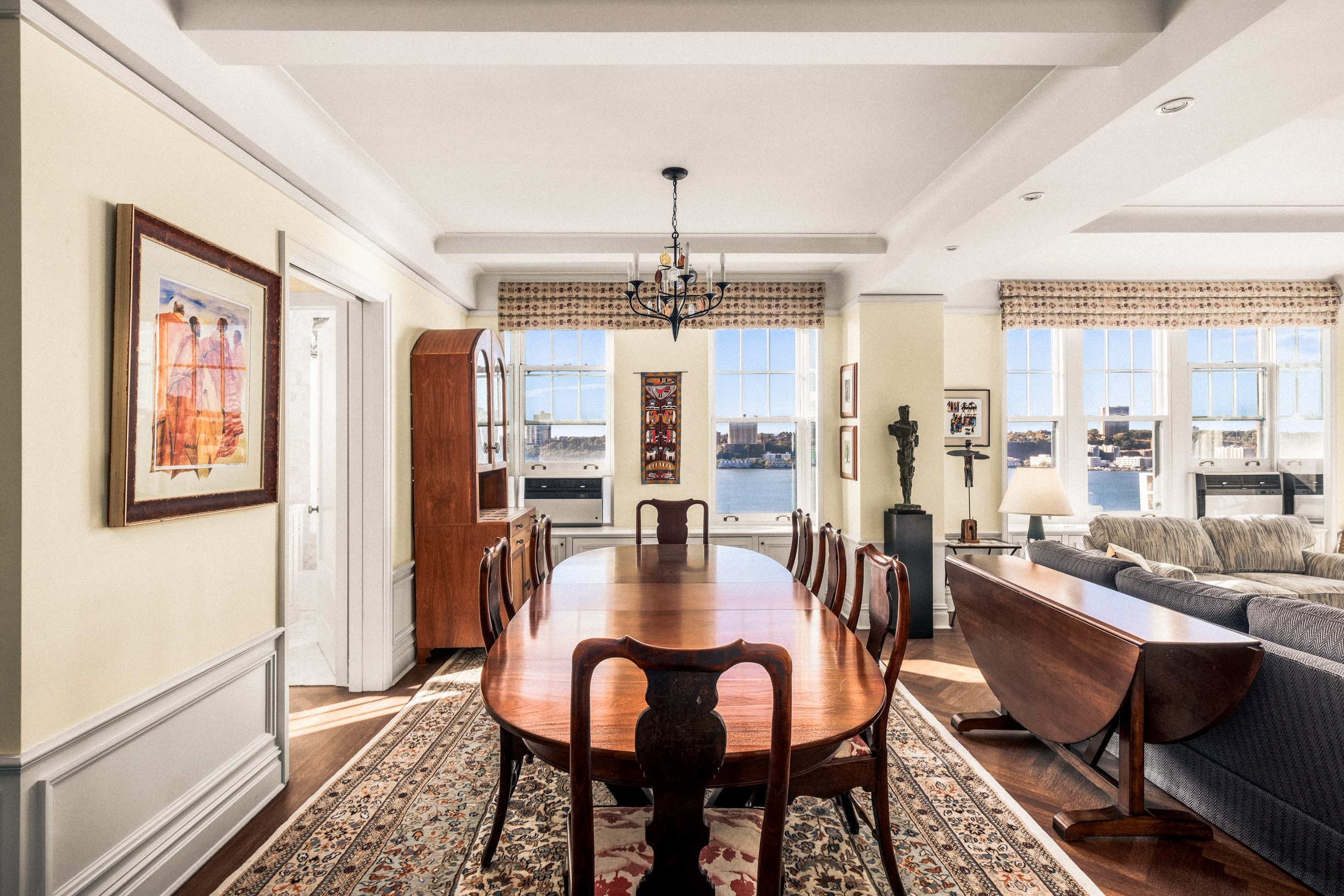 33 Riverside Drive, Unit 13AB Manhattan, NY 10023 - Photo 3 of 19 a dining room with furniture a chandelier and wooden floor