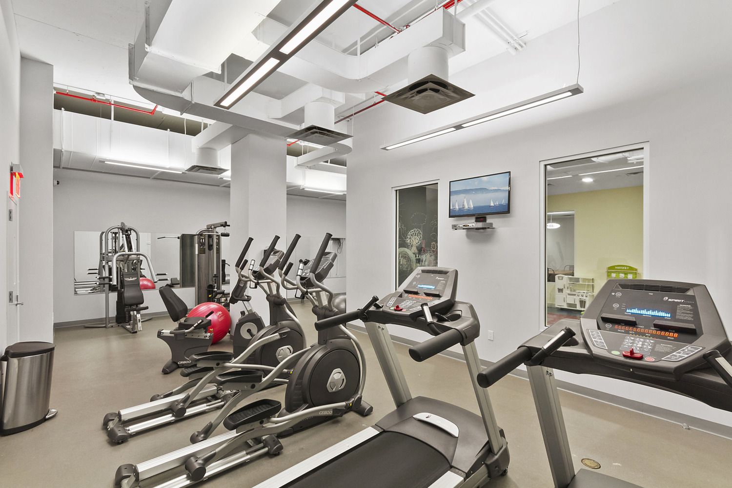 23 West 116th Street, Unit 8A Manhattan, NY 10026 - Photo 21 of 28 a view of a room with gym equipment