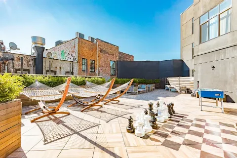 a view of a patio with chairs and tables
