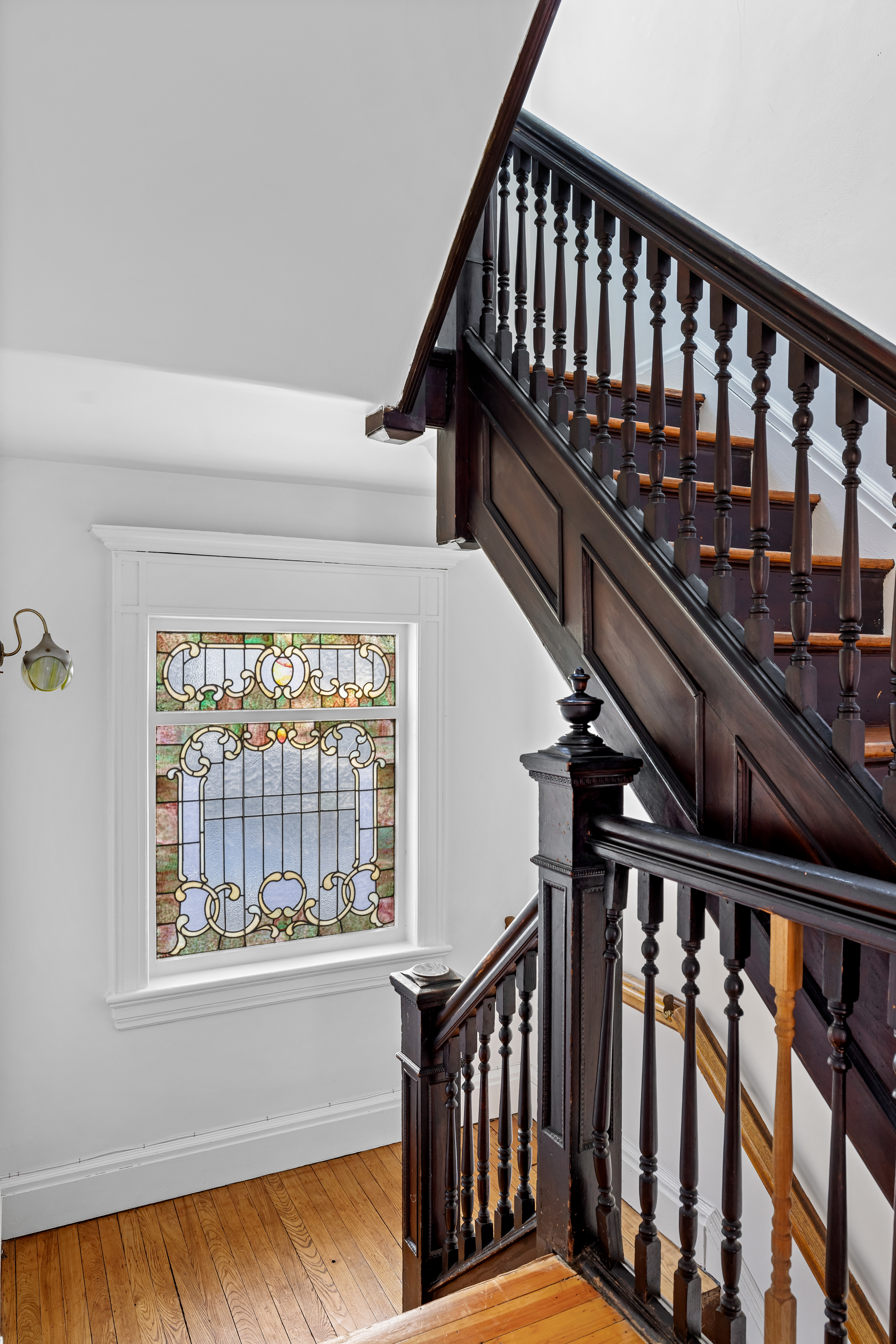 792 East 21st Street Brooklyn, NY 11210 - Photo 11 of 29 a view of staircase with railing and a window