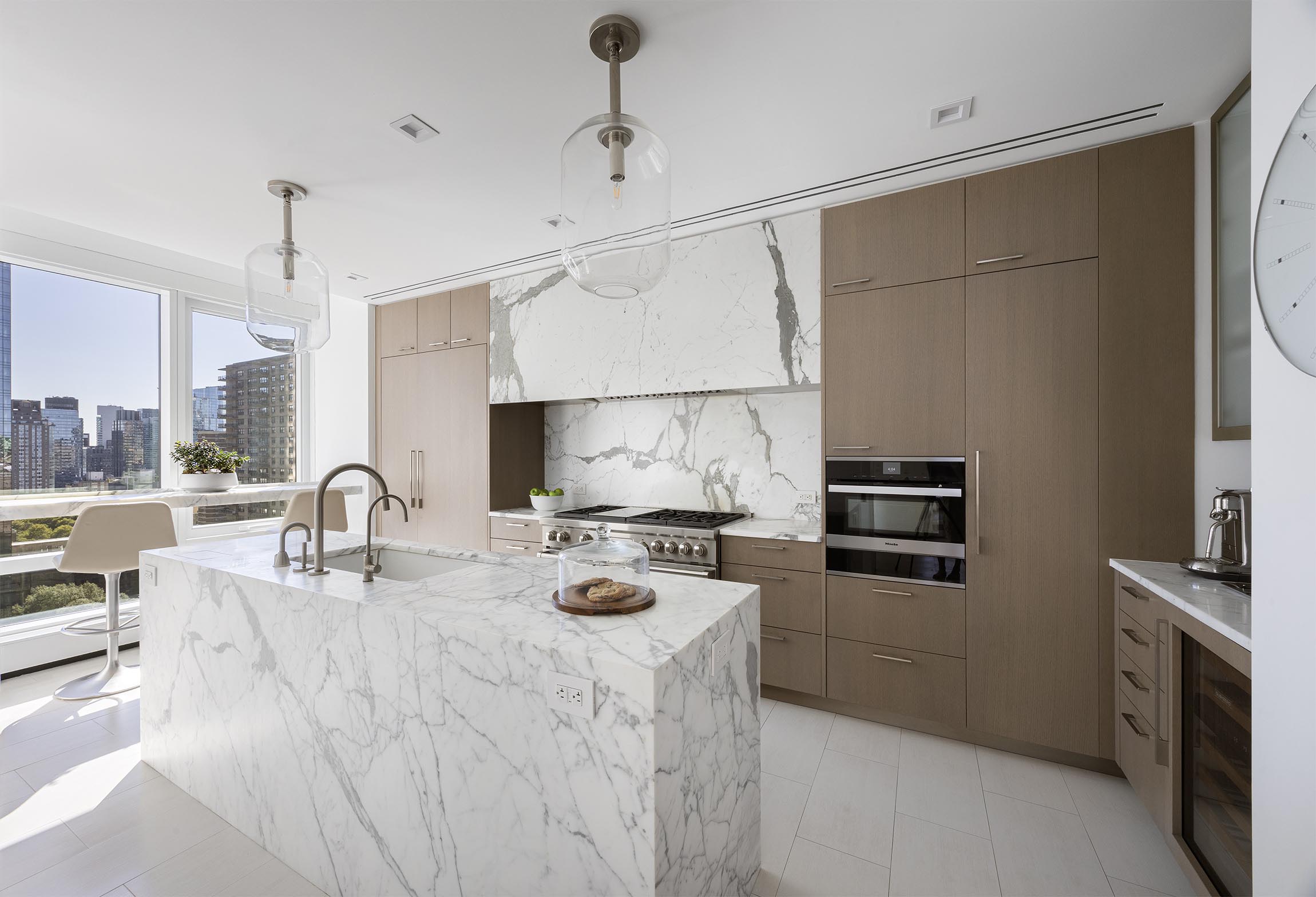 200 Amsterdam Avenue, Unit 17A Manhattan, NY 10023 - Photo 6 of 24 a kitchen with stainless steel appliances granite countertop a sink stove and refrigerator