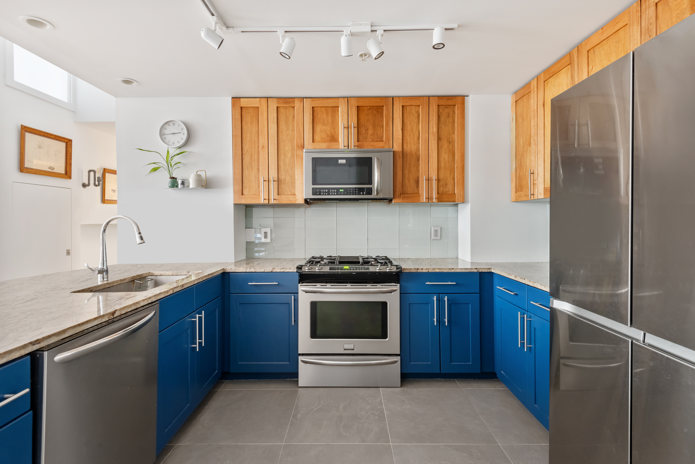 105 Lexington Avenue, Unit 2G Brooklyn, NY 11238 - Photo 5 of 17 a kitchen with stainless steel appliances granite countertop a stove and a sink