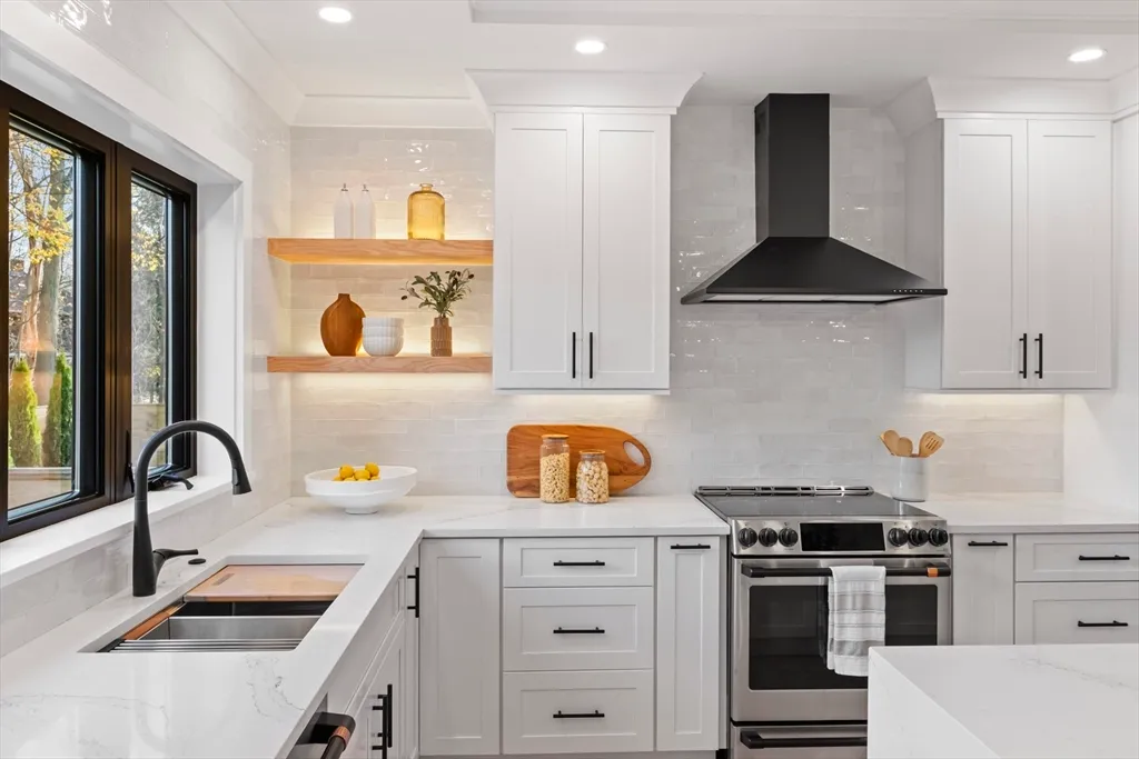 a kitchen with a stove a sink and a refrigerator