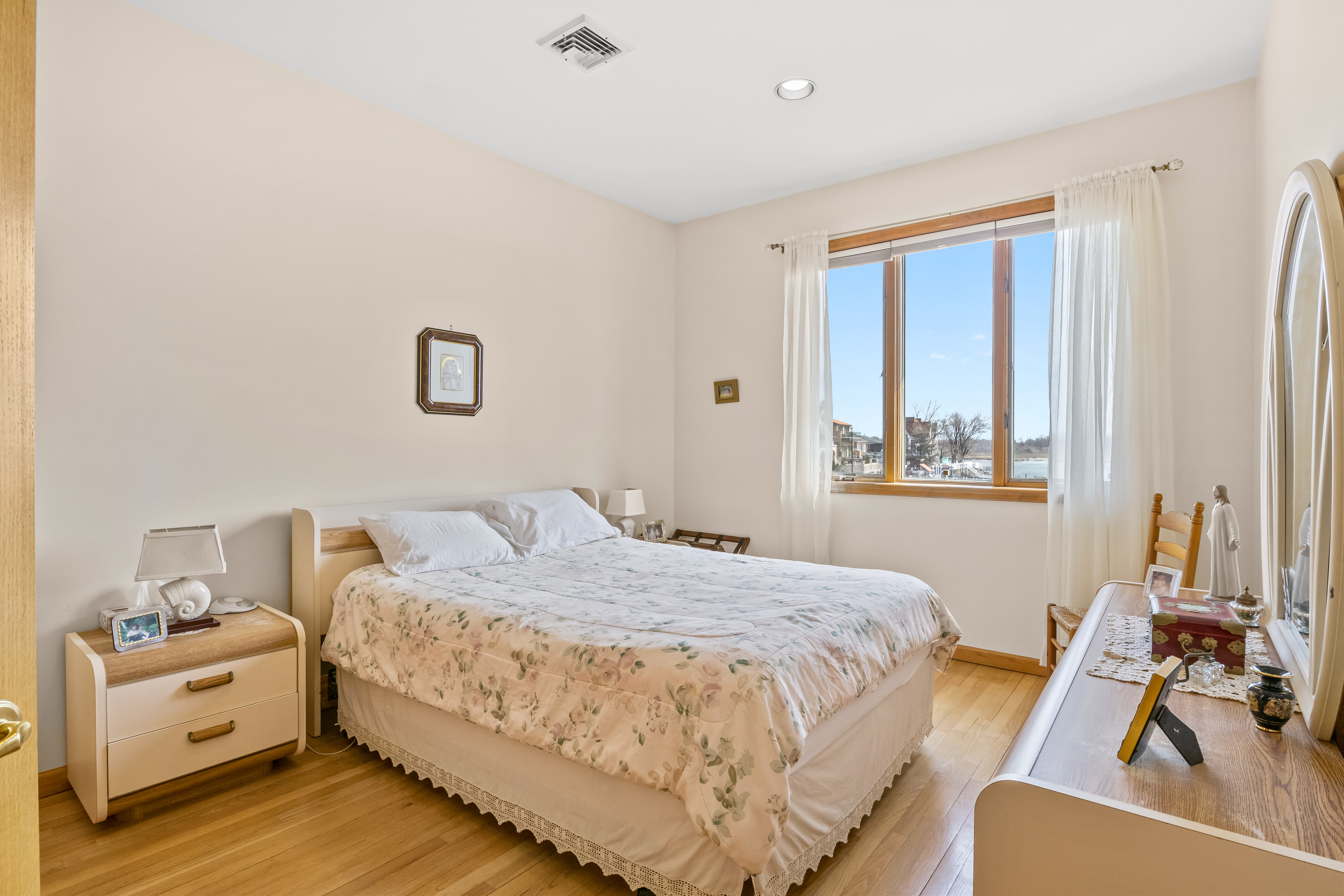 303 Whitman Drive Brooklyn, NY 11234 - Photo 19 of 37 a bedroom with a bed and a window