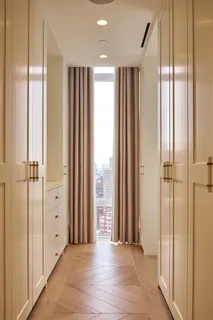 a view of a balcony with chair and door