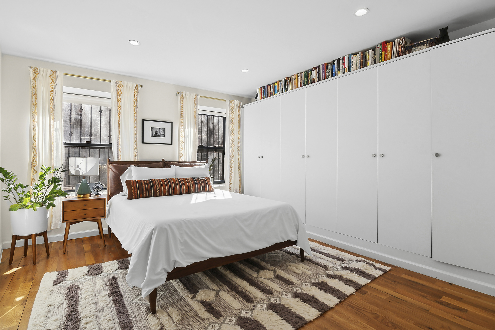 147 Herkimer Street Brooklyn, NY 11216 - Photo 14 of 25 a bedroom with a bed and a table